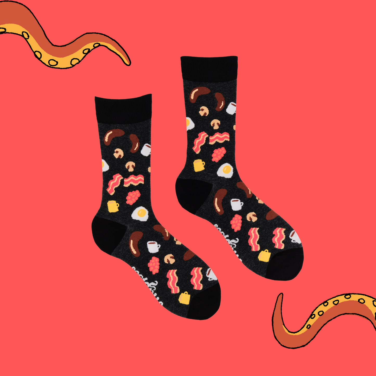 A pair of socks depicting English breakfast ingredients. Grey legs, black cuff, heel and toe.