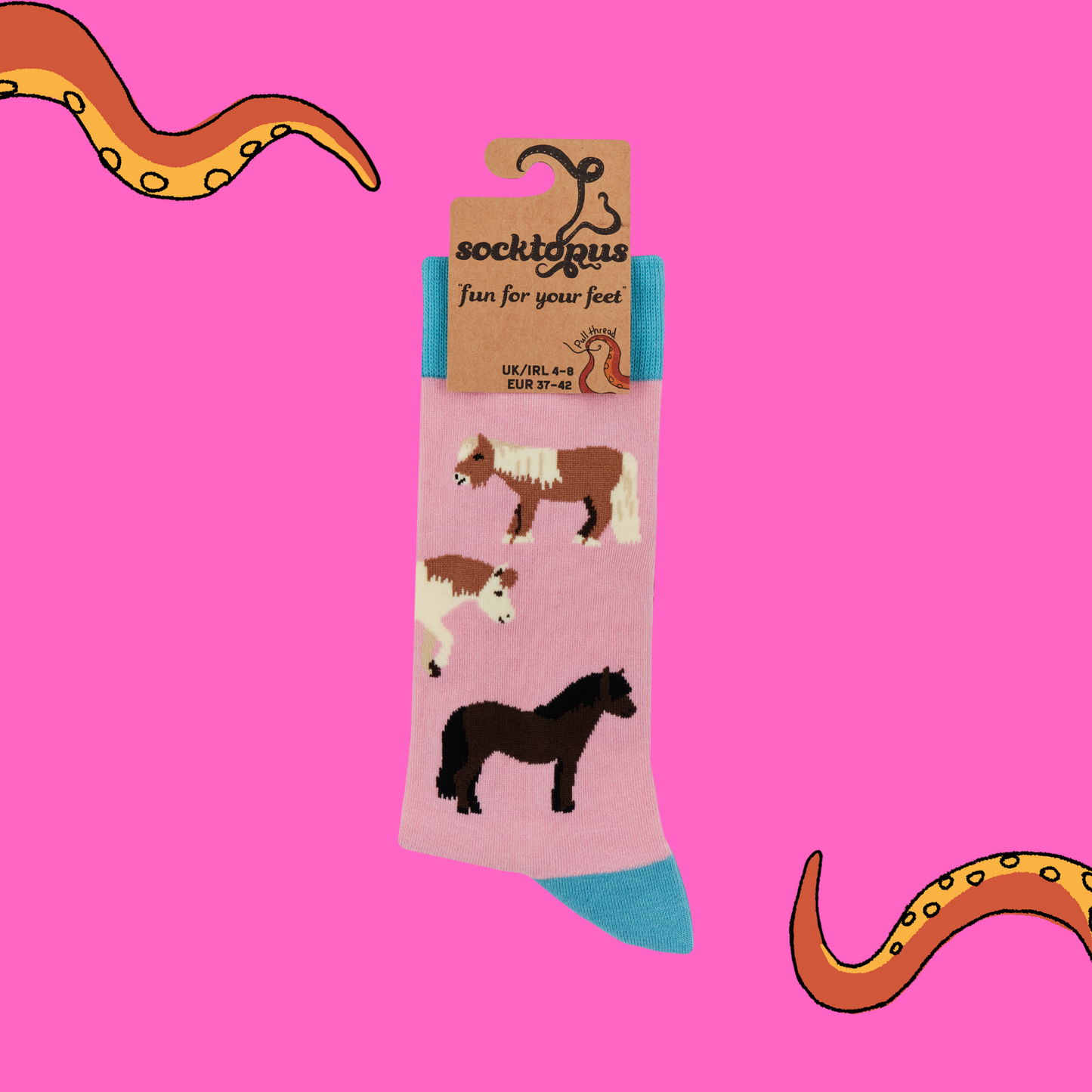 A pair of socks featuring cute ponies. Pink legs, blue heel, toe and cuff.