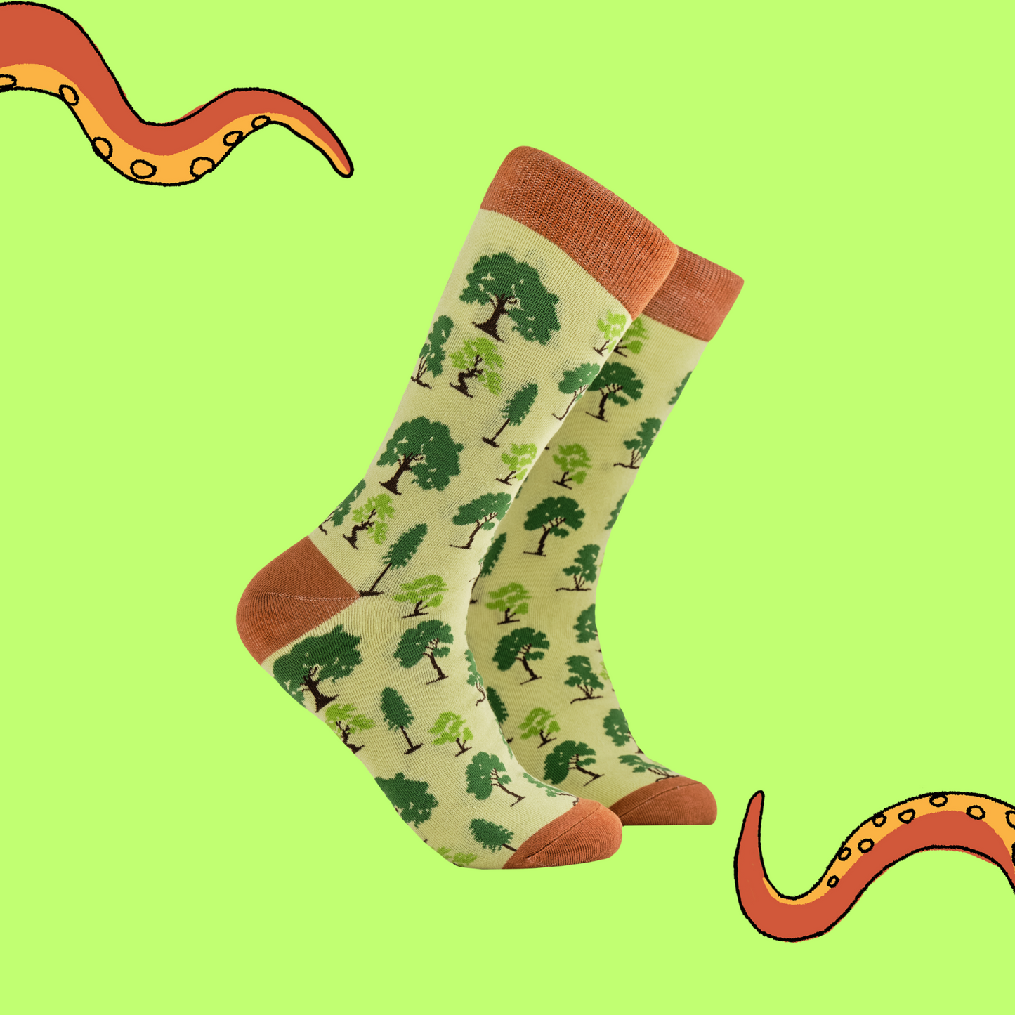 A pair of socks depicting British trees. Yellow legs, orange cuff, heel and toe.