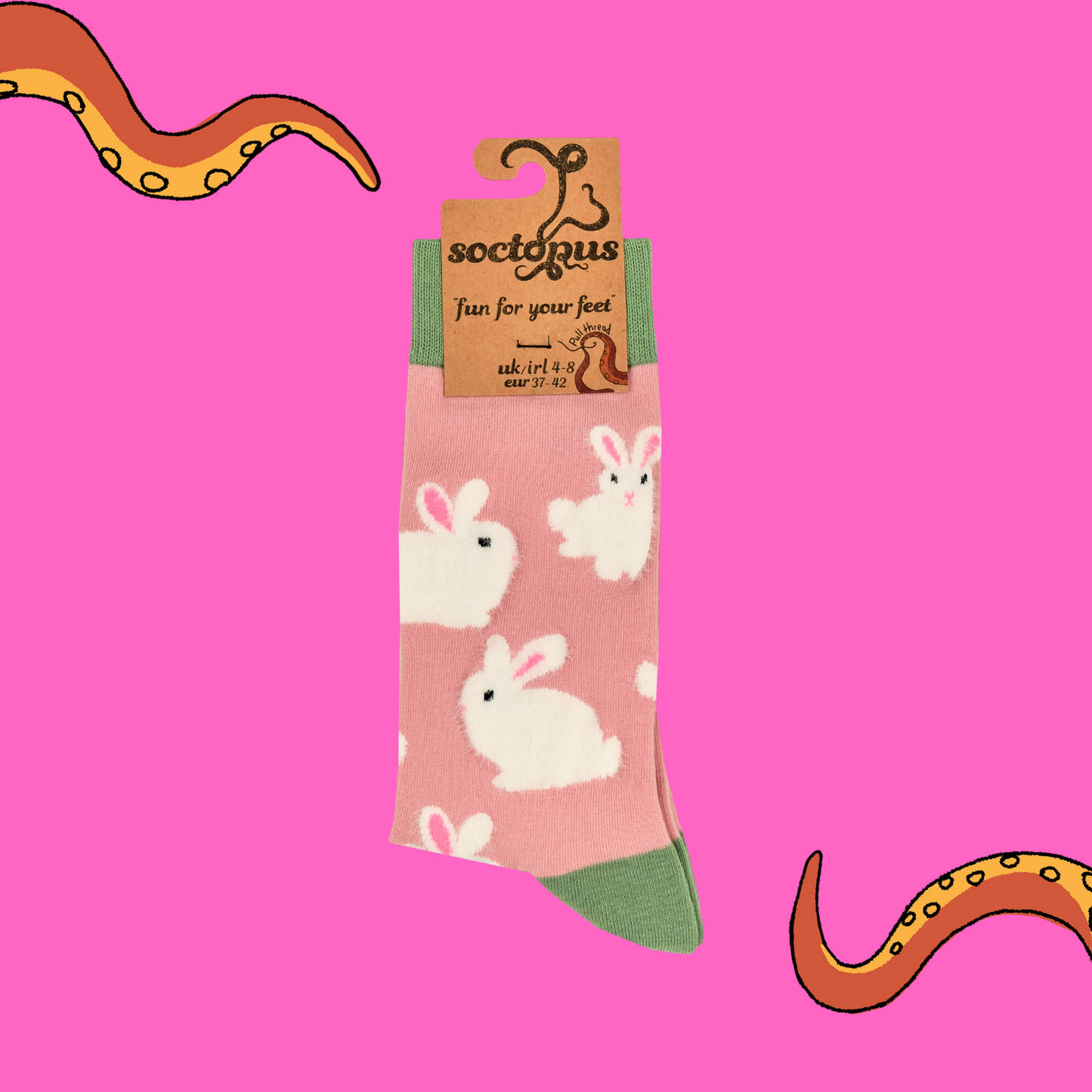 A pair of socks that feature fluffy bunnies. Pink legs, green, heel, toe and cuff.