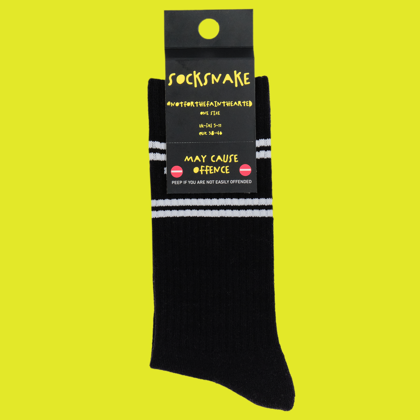 A black pair of athletic socks with white trim on the ankles and toes. A euphemism for the female genitals on the ankle. In socksnake packaging.