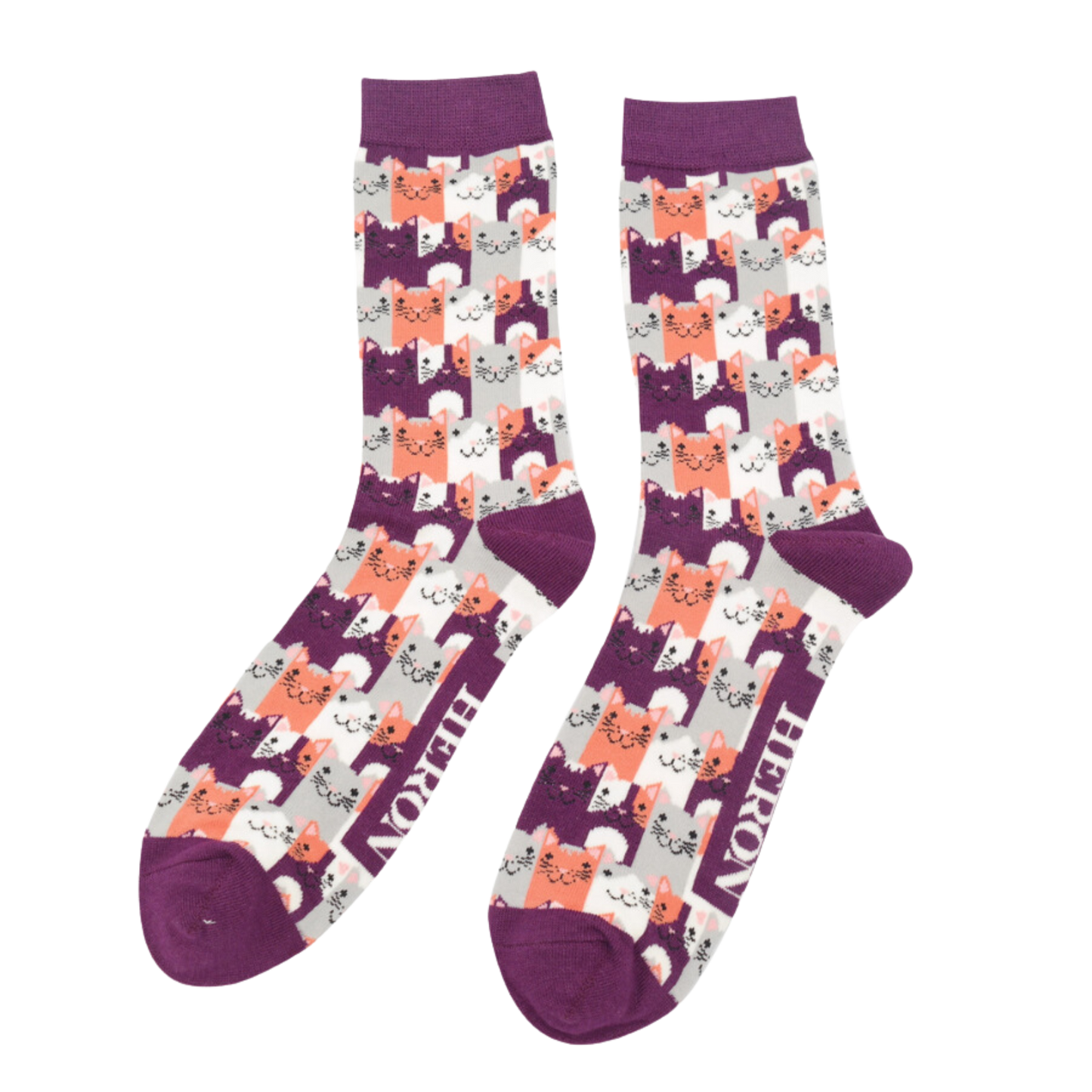 A pair of socks with a multicoloured happy anime cat pattern. Purple heel, toe and cuff.