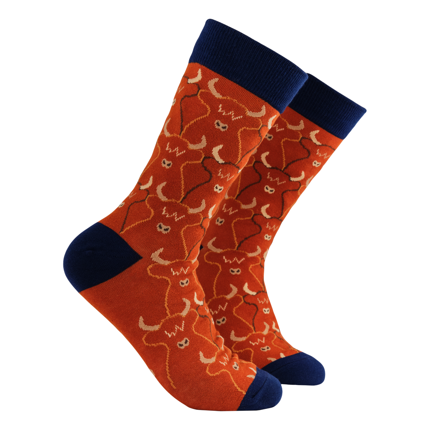 Highland Cow Socks - Herd Mentality. A pair of socks featuring a highland cow pattern. Ref legs, dark blue heel, toe and cuff.