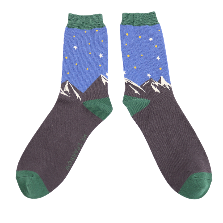 Mountain Scene Bamboo Socks - Miss Sparrow. A pair of socks featuring a mountain scene. Green heel, toe and cuff.