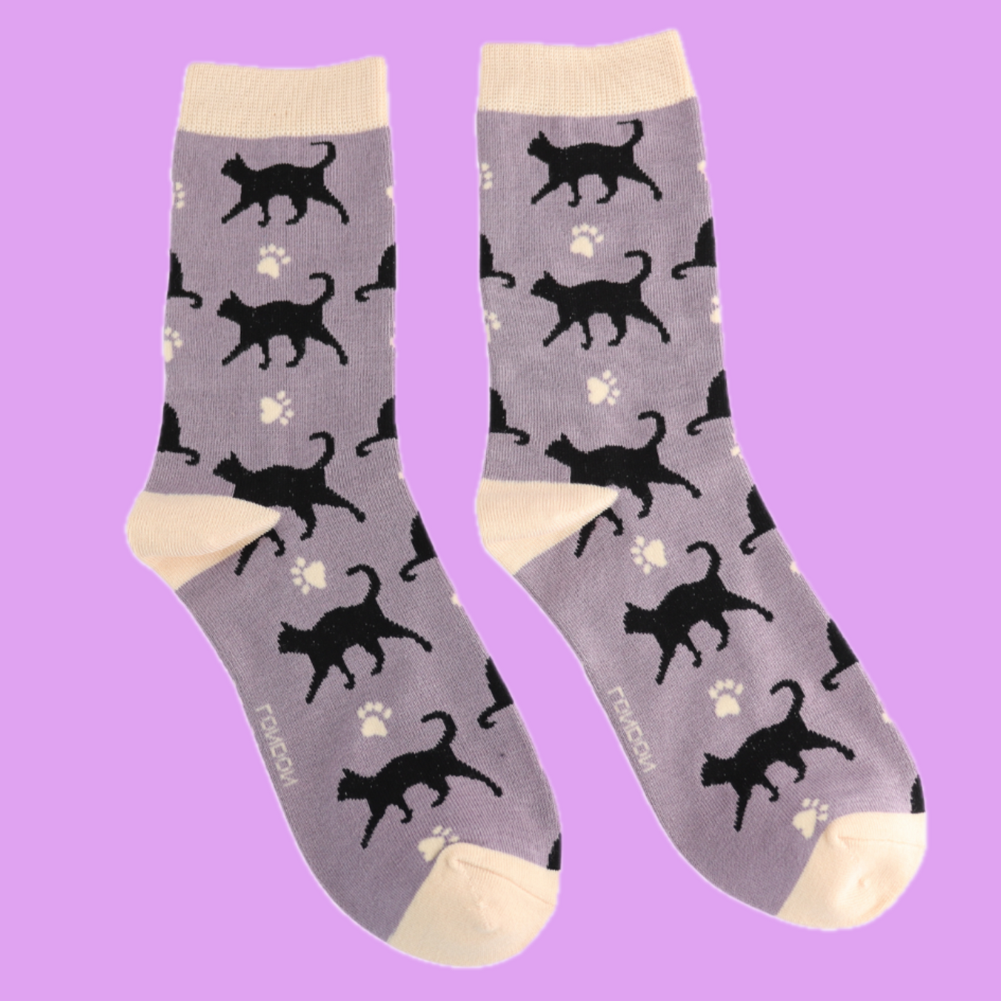 A pair of socks featuring cats and cat prints. Grey legs, yellow heel, toe and cuff.