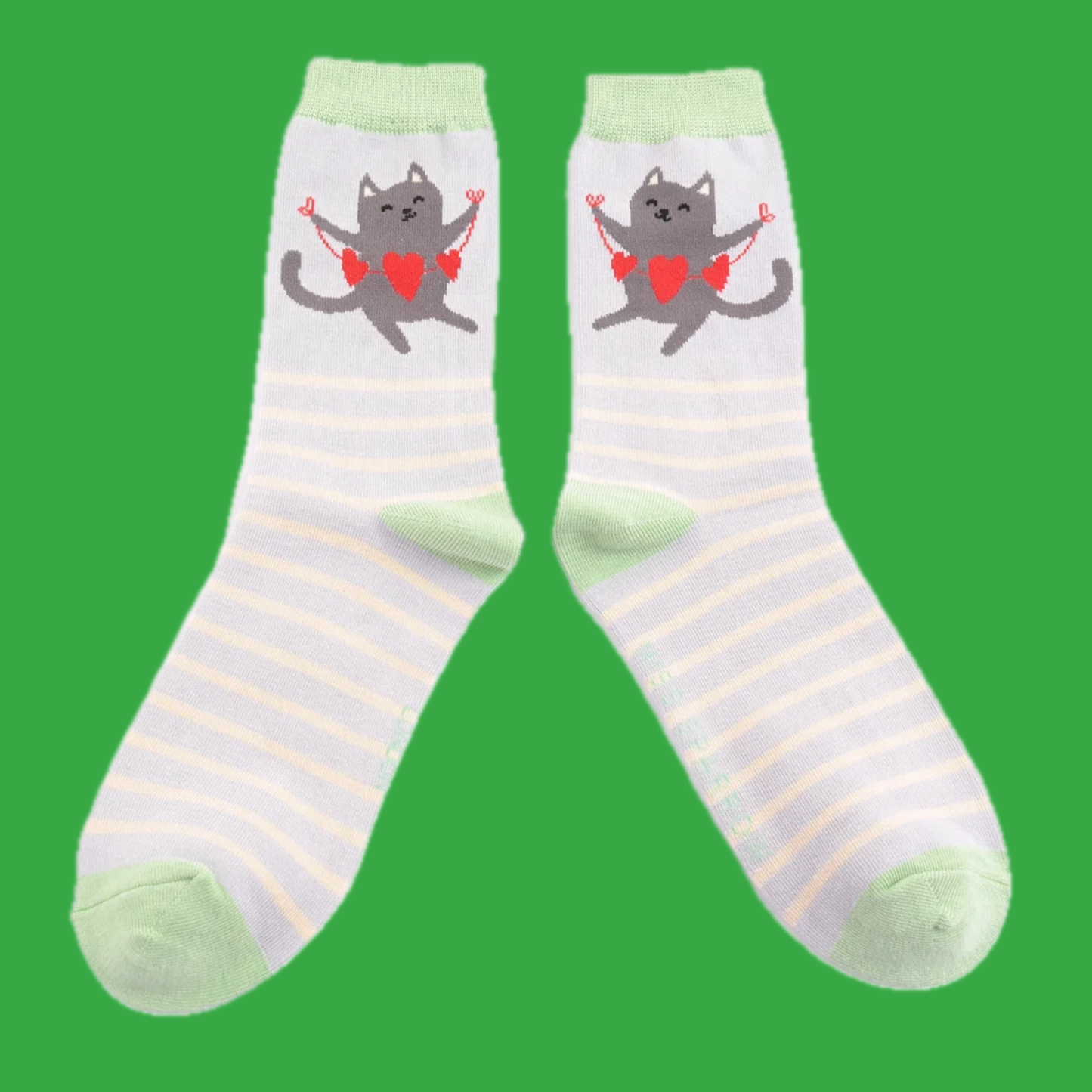 A pair of socks featuring a happy cat. Pink striped legs. Blue heel toe and cuff.