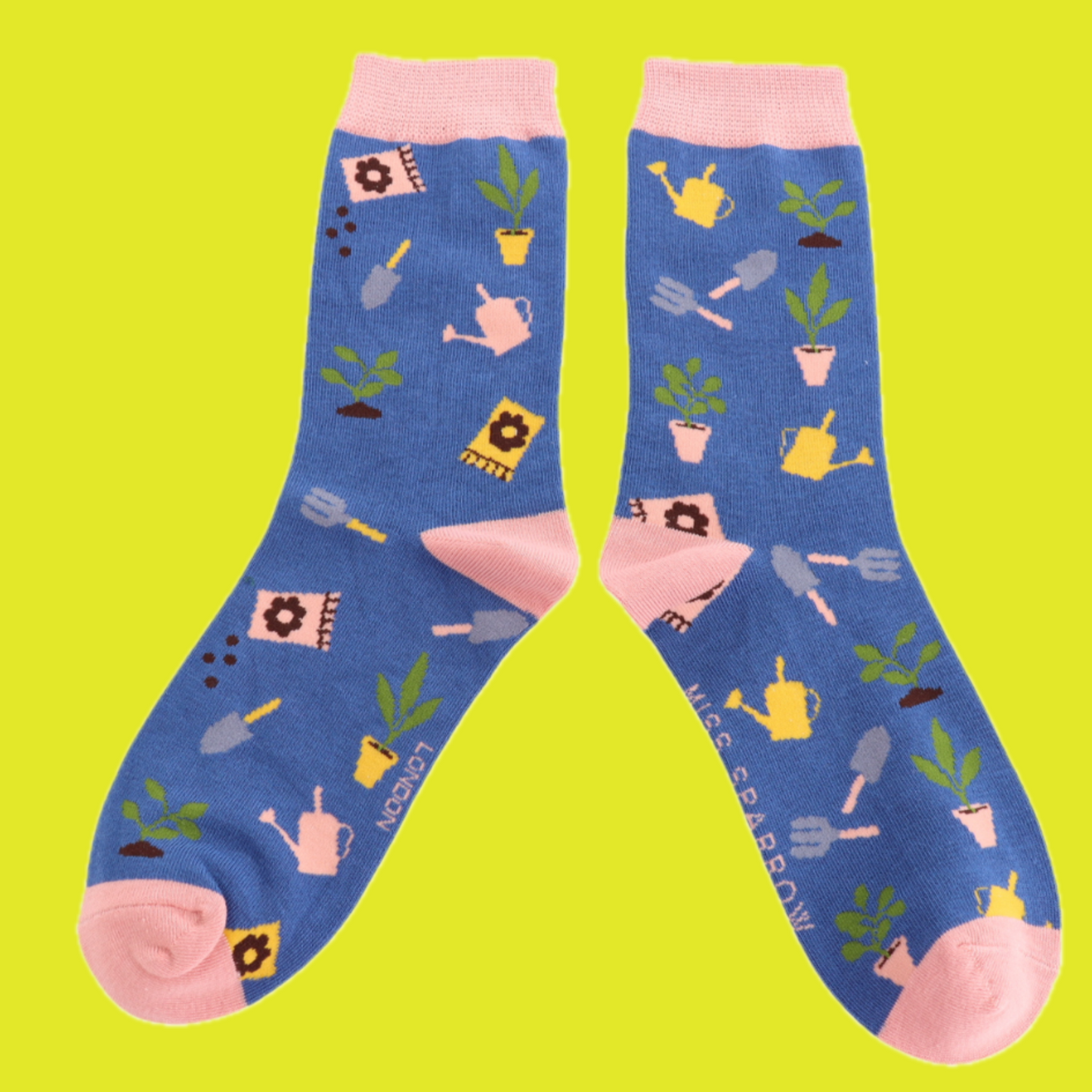 A pair of socks with an allotment motif. Blue legs, pink heel toe and cuff.