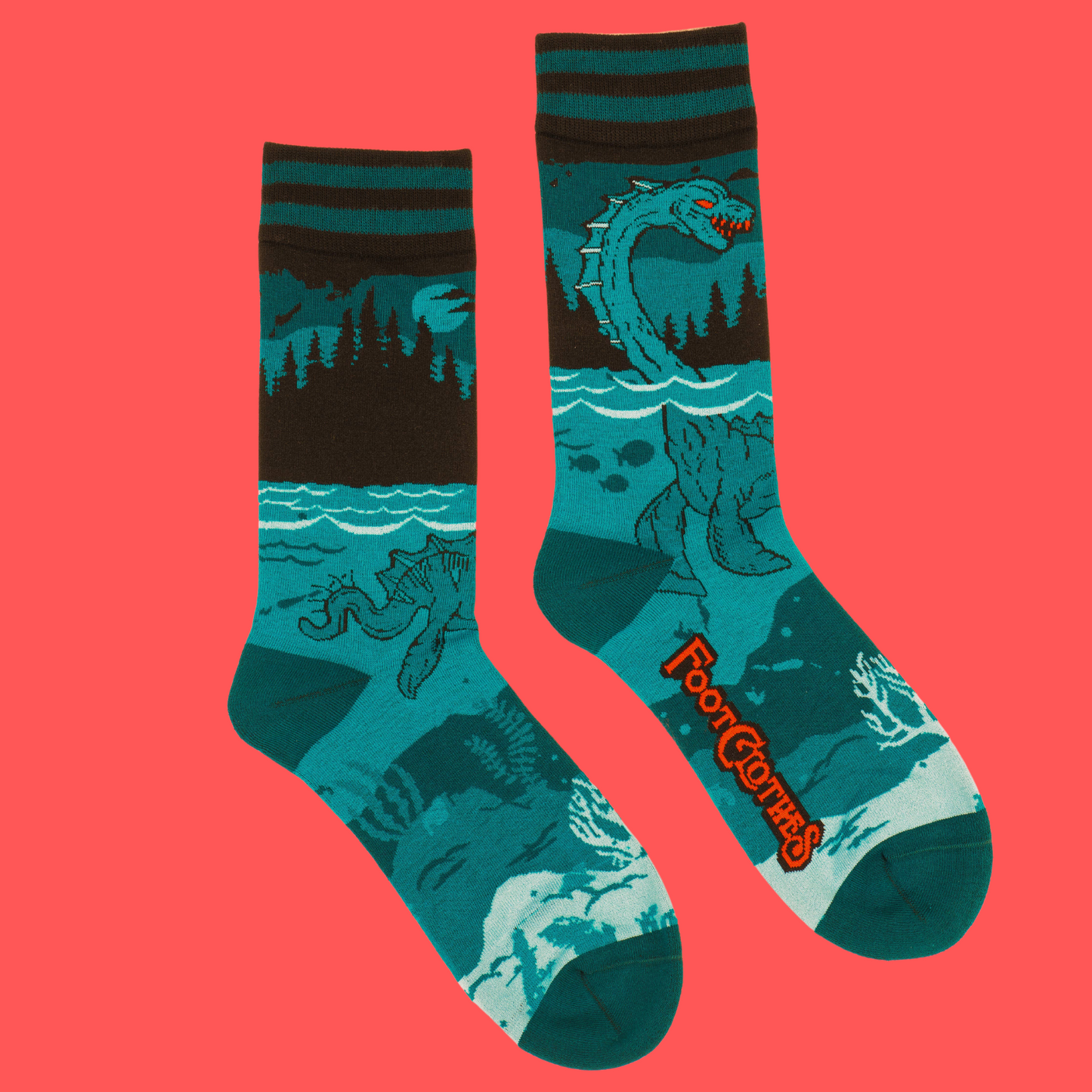 A pair of socks featuring the Loch Ness Monster. Blue legs, blue heel, toe and cuff.