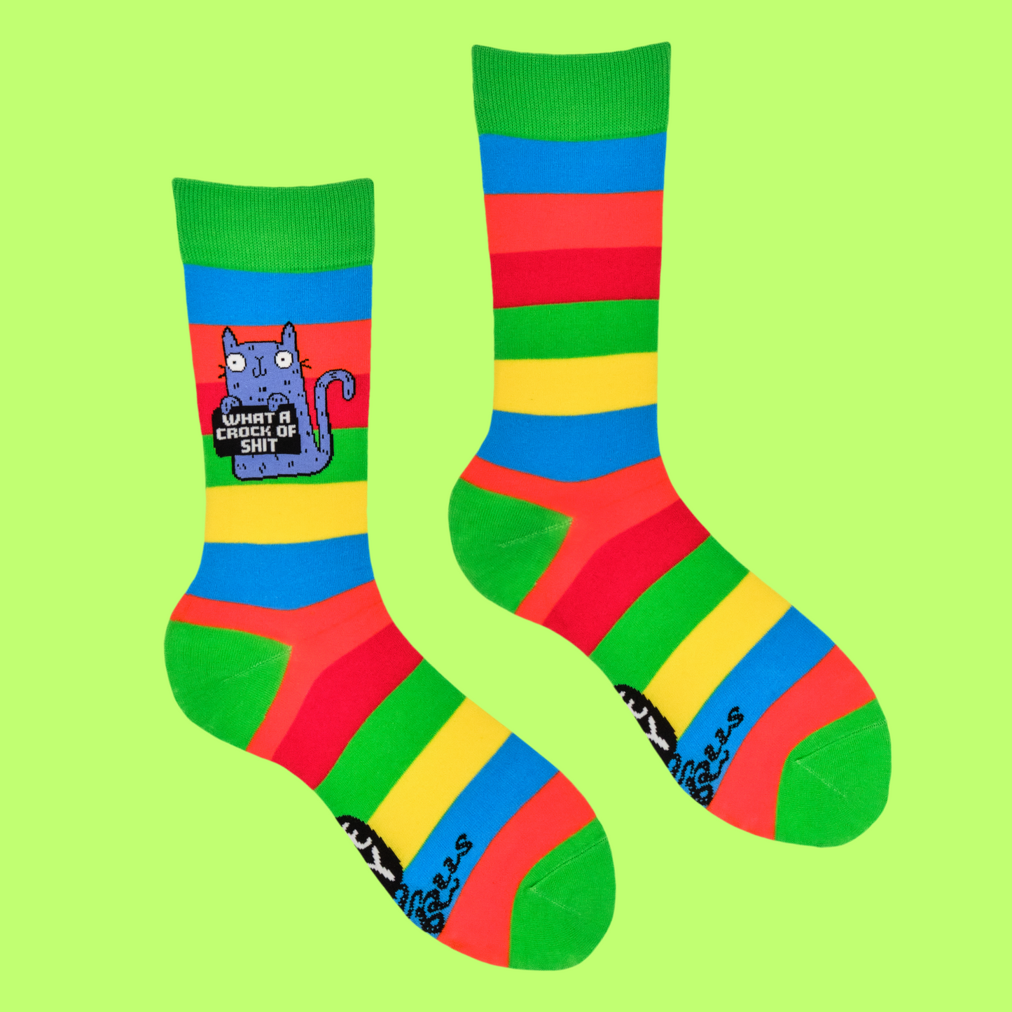 A pair of socks featuring a cute cat holding a sweary sign. Multicolored striped legs.