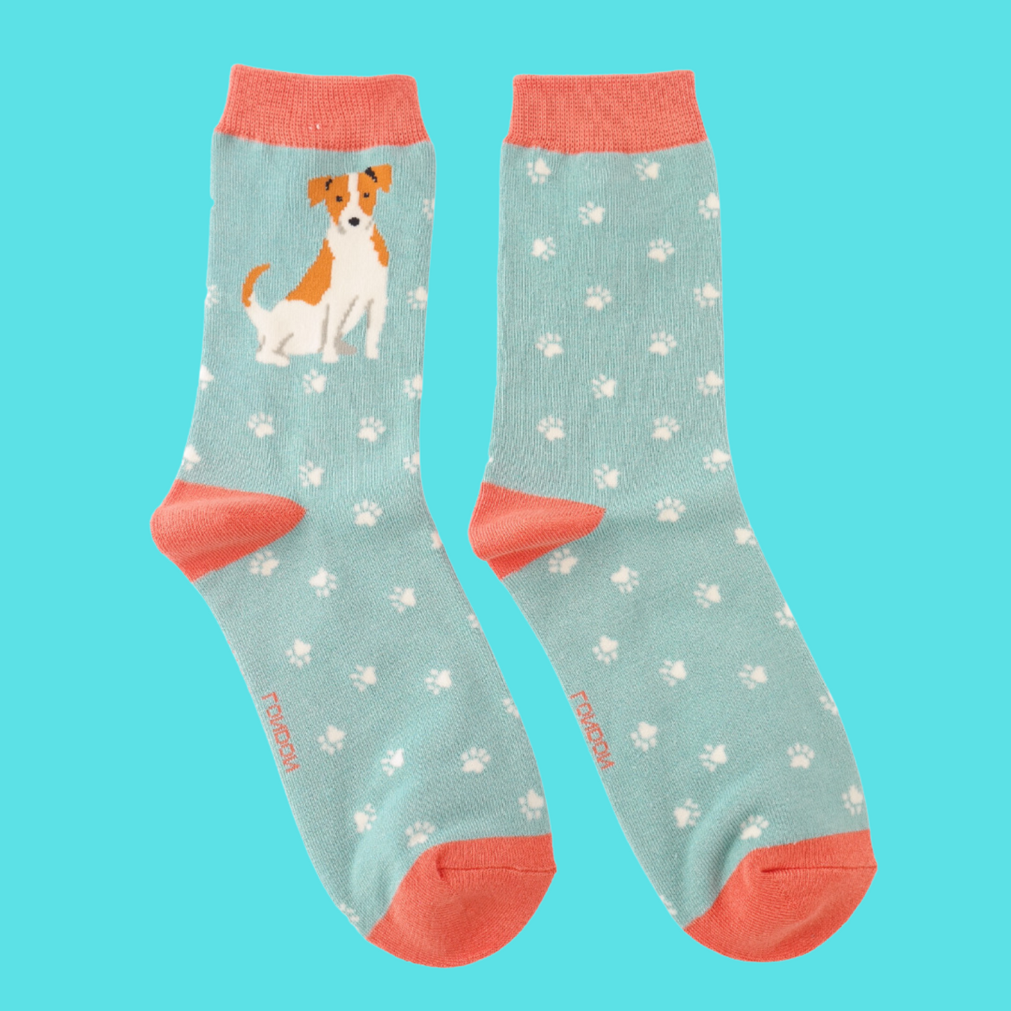 A pair of socks featuring a cute jack russell. Light blue legs, peach heel, toe and cuff.