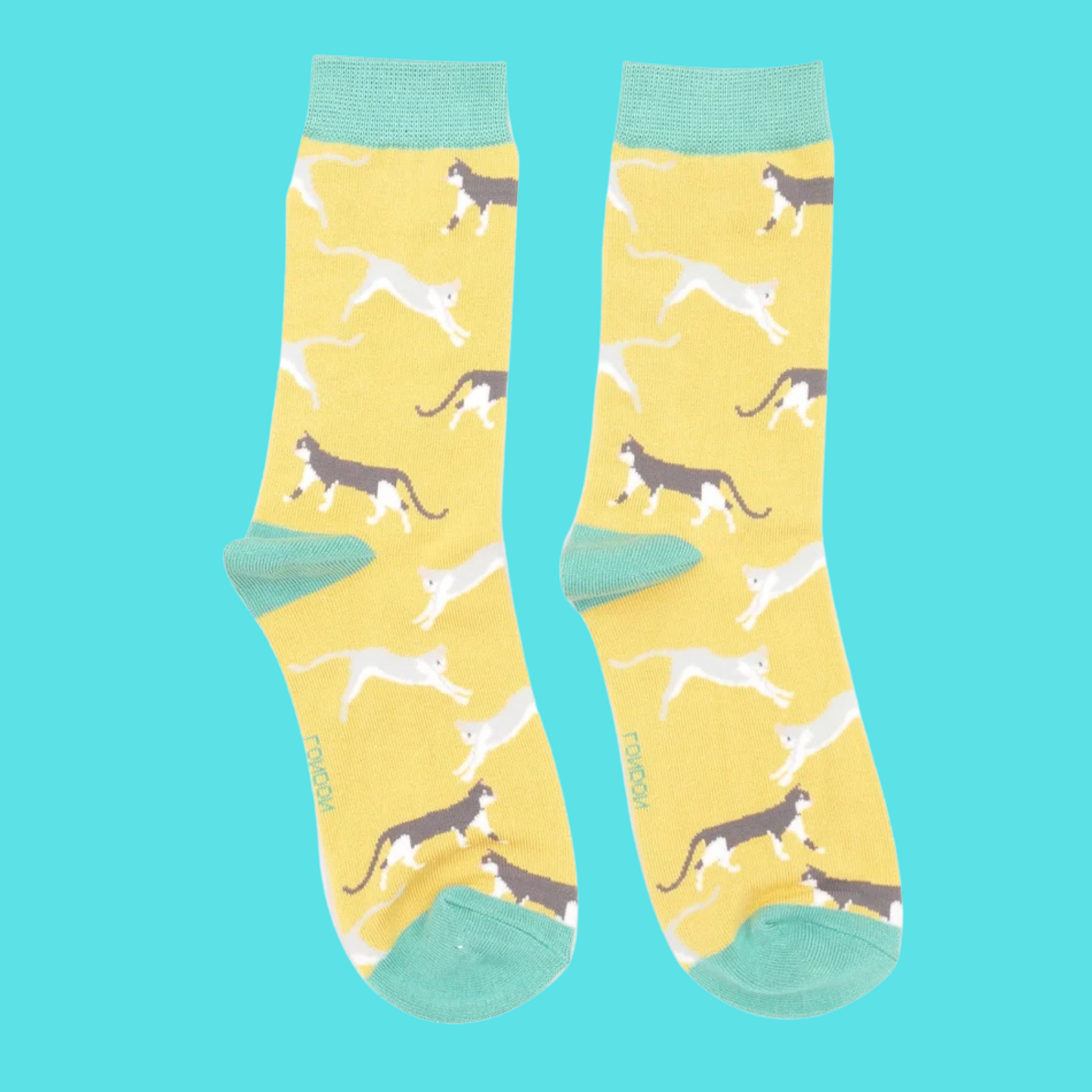 A pair of socks featuring wandering cats. Yellow legs, teel heel, toe and cuff.