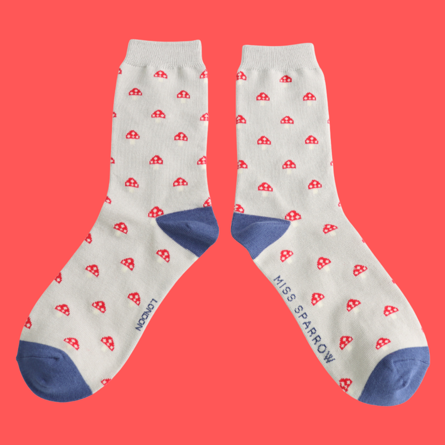Little Mushrooms Bamboo Socks - Miss Sparrow. A pair of socks with a toadstool pattern. Grey legs, blue heel and toe.