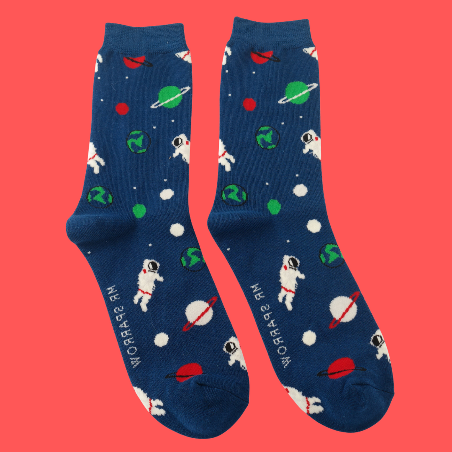 Astronaut Space Bamboo Socks - Miss Sparrow. A pair of socks with a space motif. Dark blue legs, toe, heel and cuff.