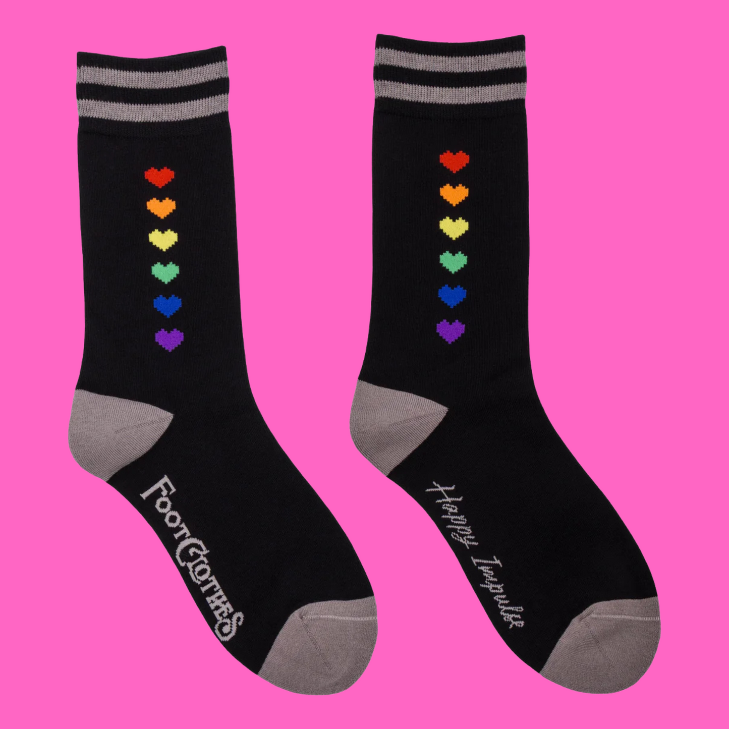 Pride Pixel Hearts Crew Socks. A pair of socks with a pixelated heart motif. Black legs, grey heel, toe and cuff.