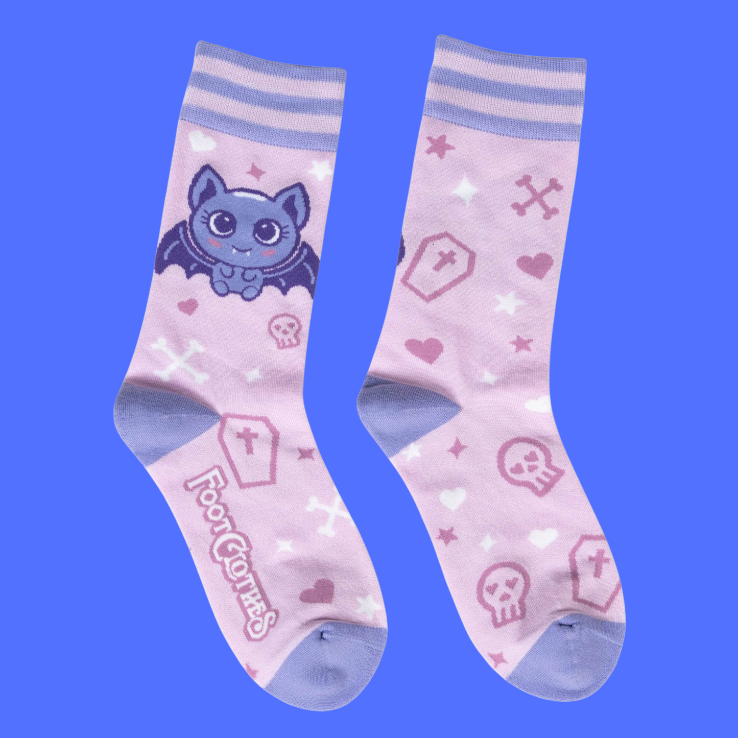 A pair of socks with a cute bat motif. Pink legs, light purple heel, toe and cuff.