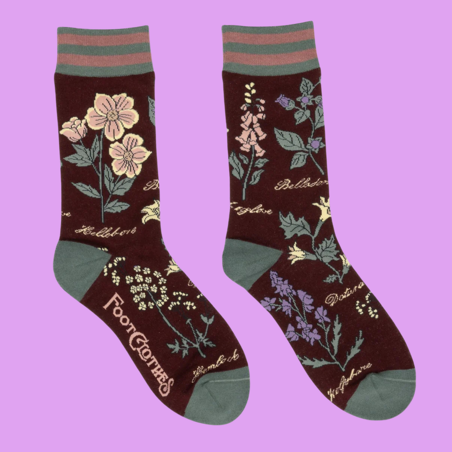 Baneful Botany Crew Socks. A pair of socks with a botany motif. Brown legs, green heel, toe and cuff.