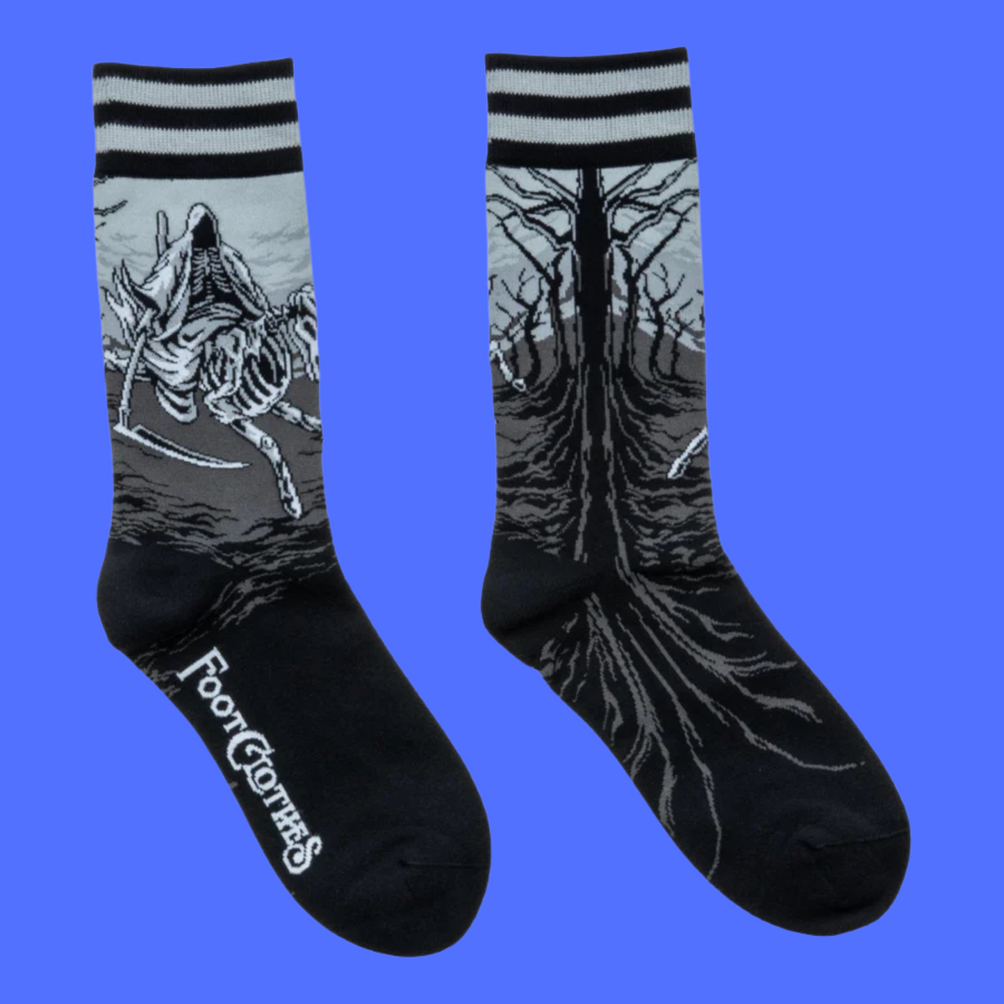A pair of socks featuring death on a horse. Black legs, grey heel and cuff.