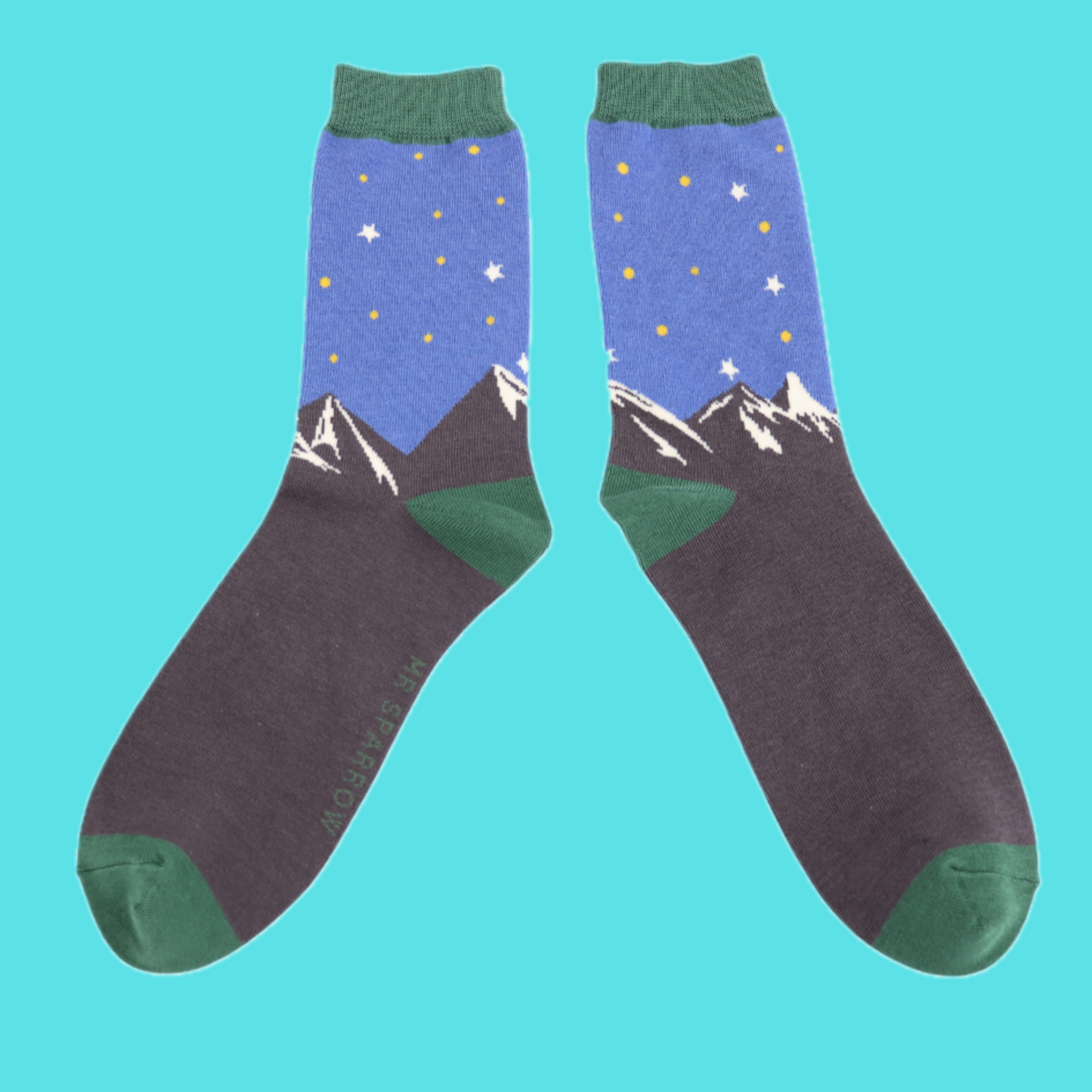 Mountain Scene Bamboo Socks - Miss Sparrow. A pair of socks featuring a mountain scene. Green heel, toe and cuff.