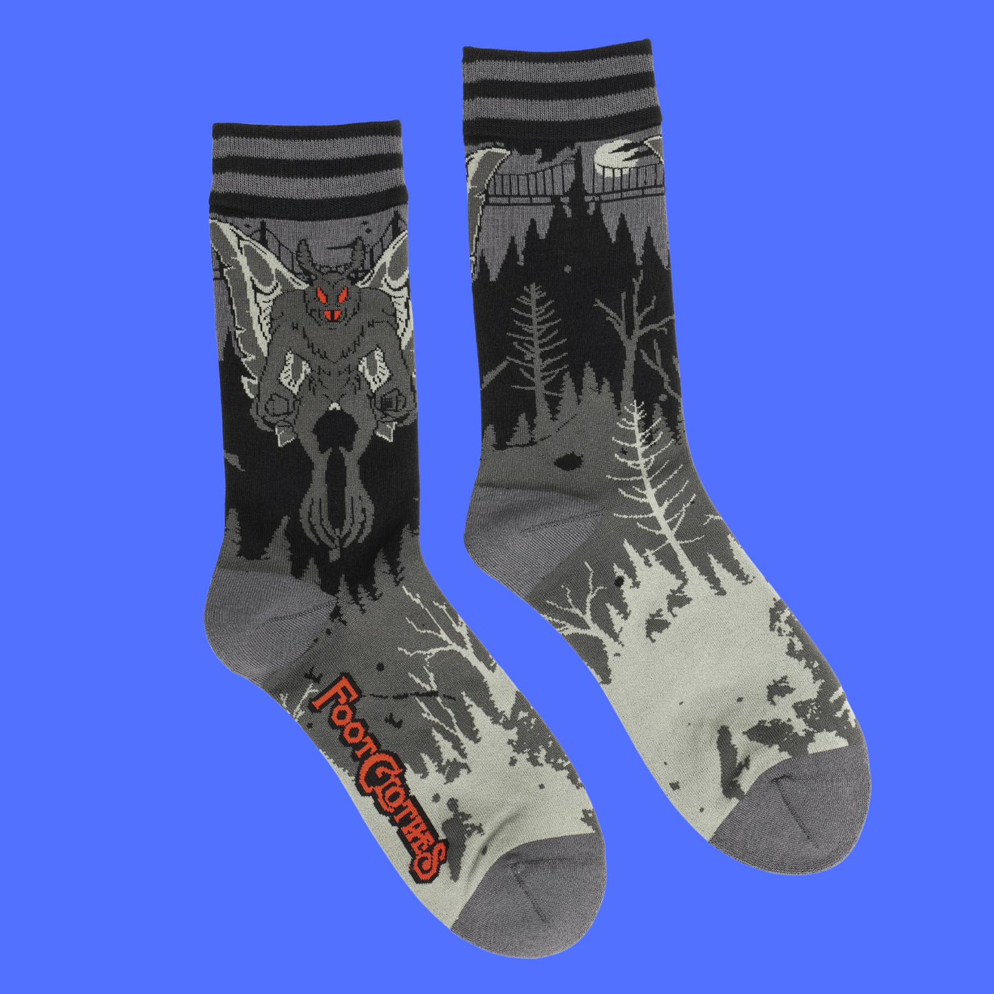 A pair of socks featuring Mothman. Grey legs, grey heel, toe and cuff.