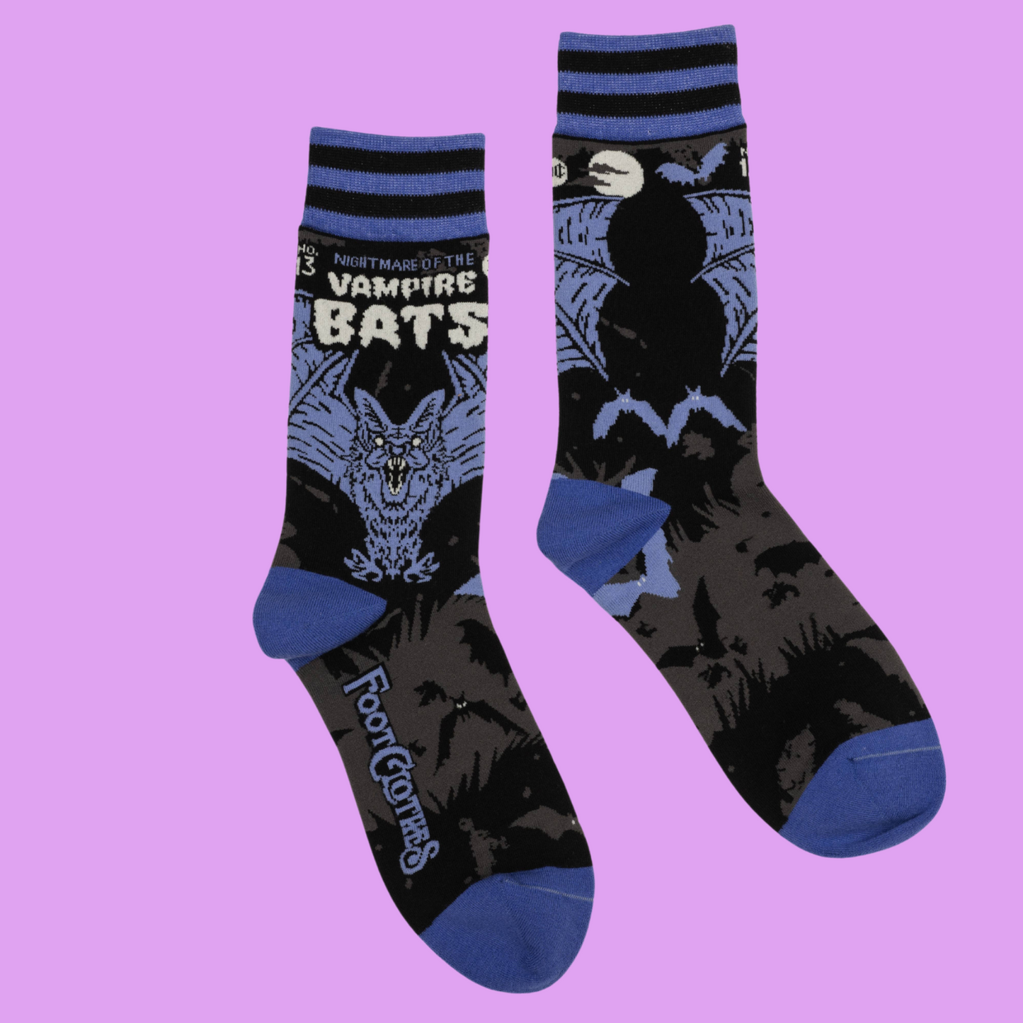A pair of socks depicting a scary looking vampire bat. Blue toes, cuff and heel.