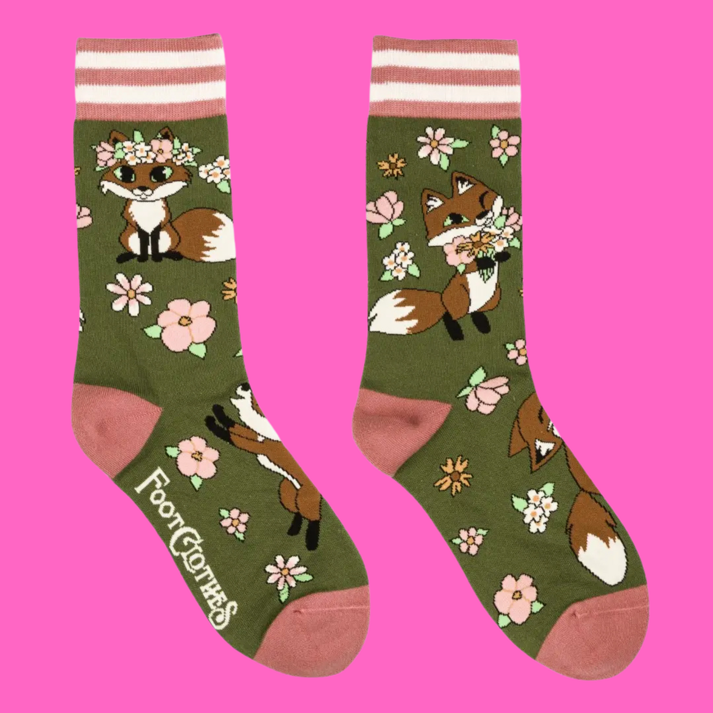 A pair of socks featuring cute woodland foxes. Green legs, pink heel, toe and cuff.