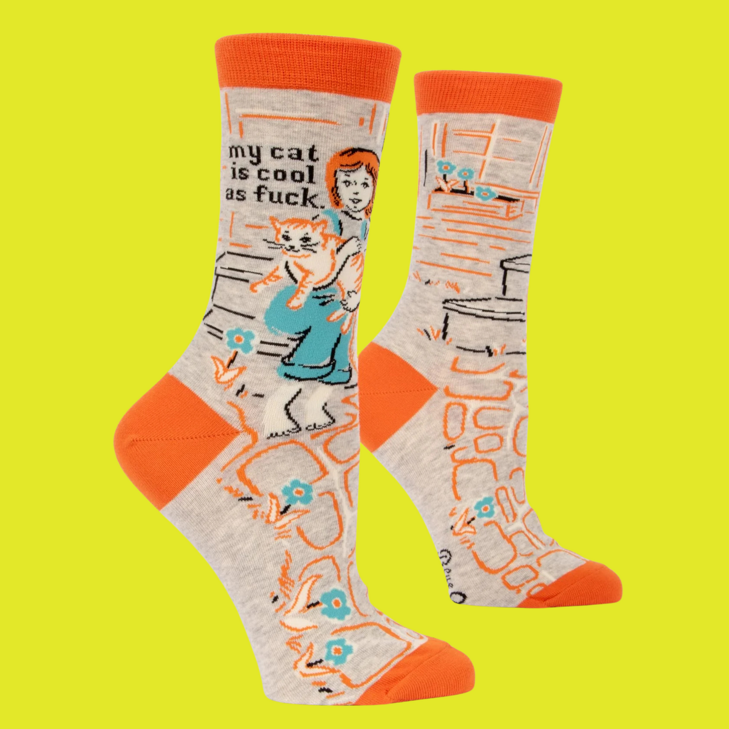 A pair of socks depicting cool cats. Brown legs, orange heel, toe and cuff.