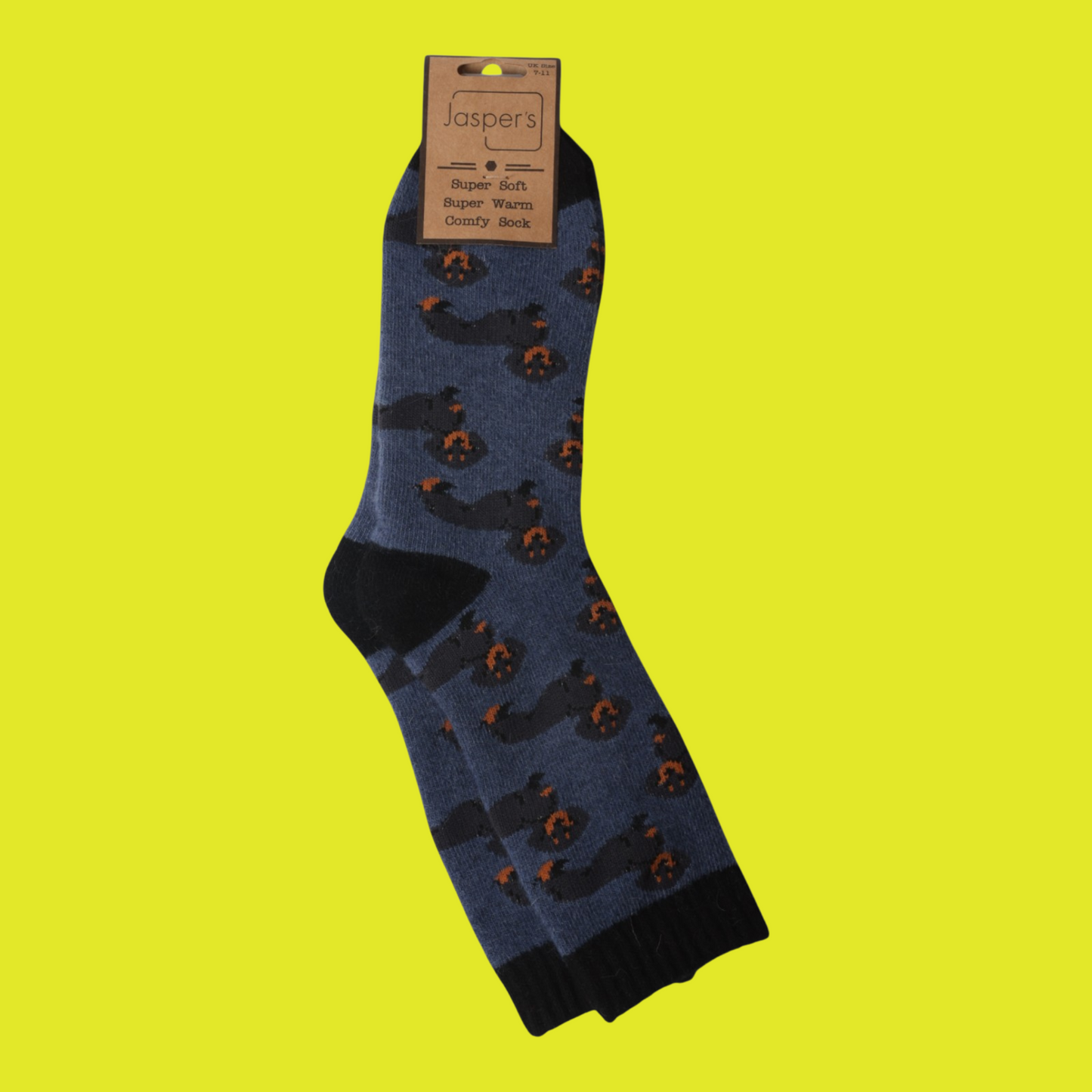 Blue sock with sausage dog pattern on a yellow background