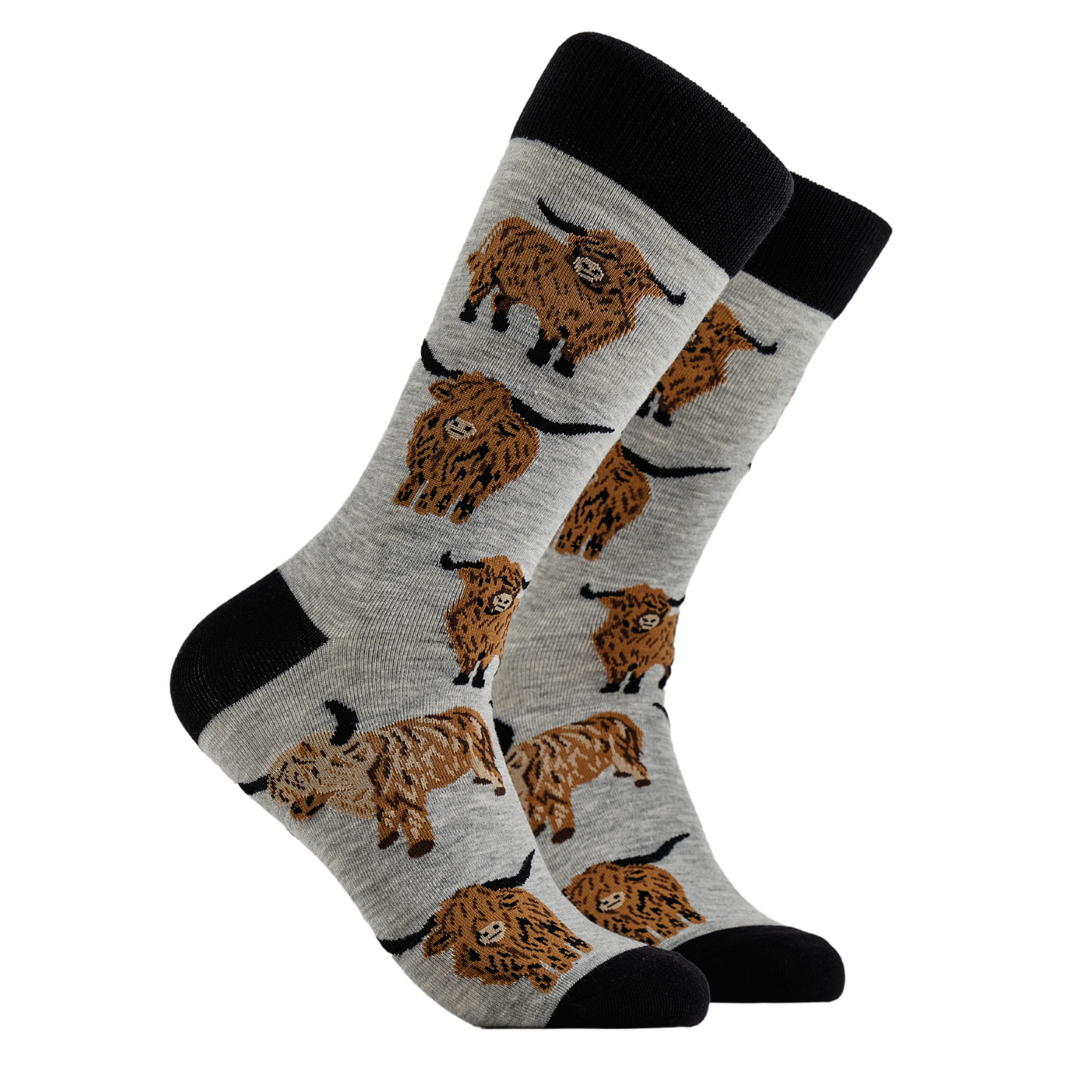 A pair of socks depicting highland cows. Grey legs, black cuff, heel and toe.