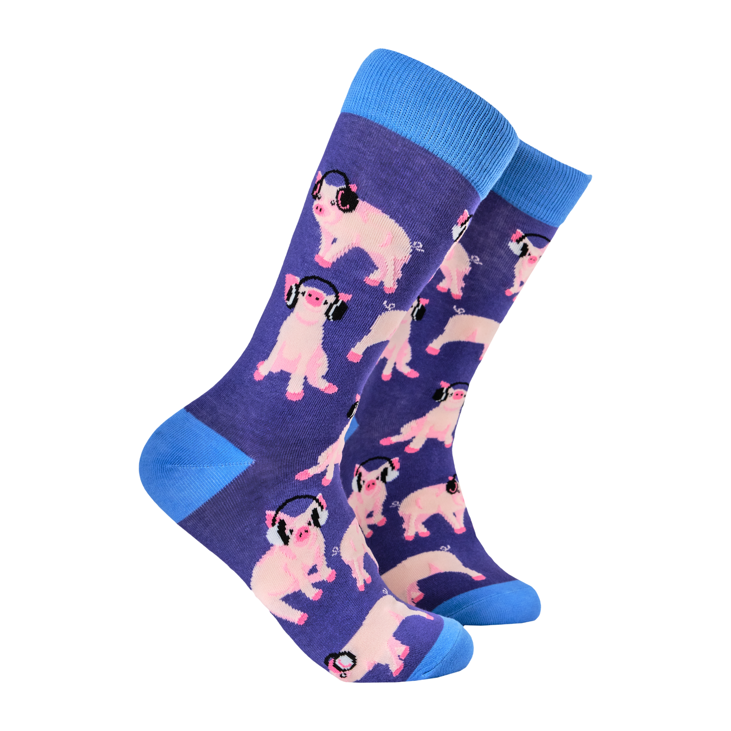 A pair of socks with a pattern of cartoon pigs wearing headphones on a pink background.