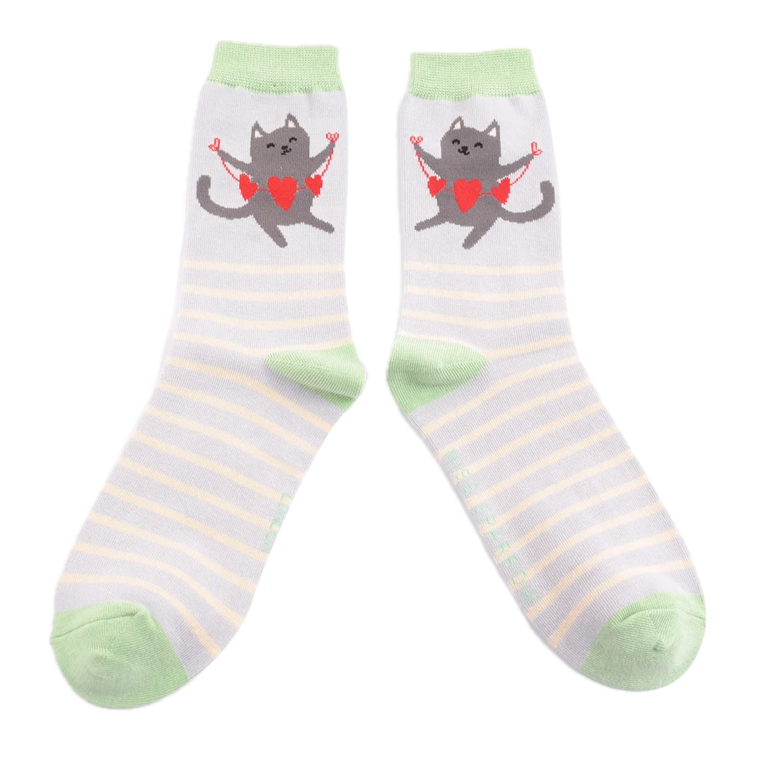 A pair of socks featuring a happy cat. Pink striped legs. Blue heel toe and cuff.