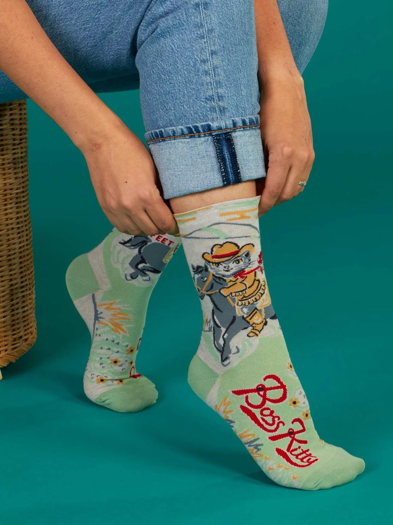 Boss Kitty Socks. A pair of socks featuring Boss Kitty. A cat riding on a horse.