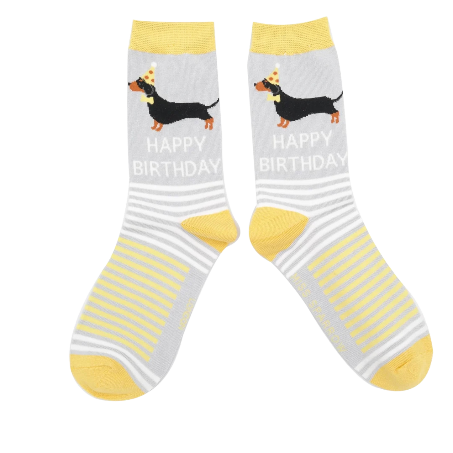 A pair of socks featuring sausage dogs all dressed up for a party. Grey legs, yellow heel, toe and cuff.