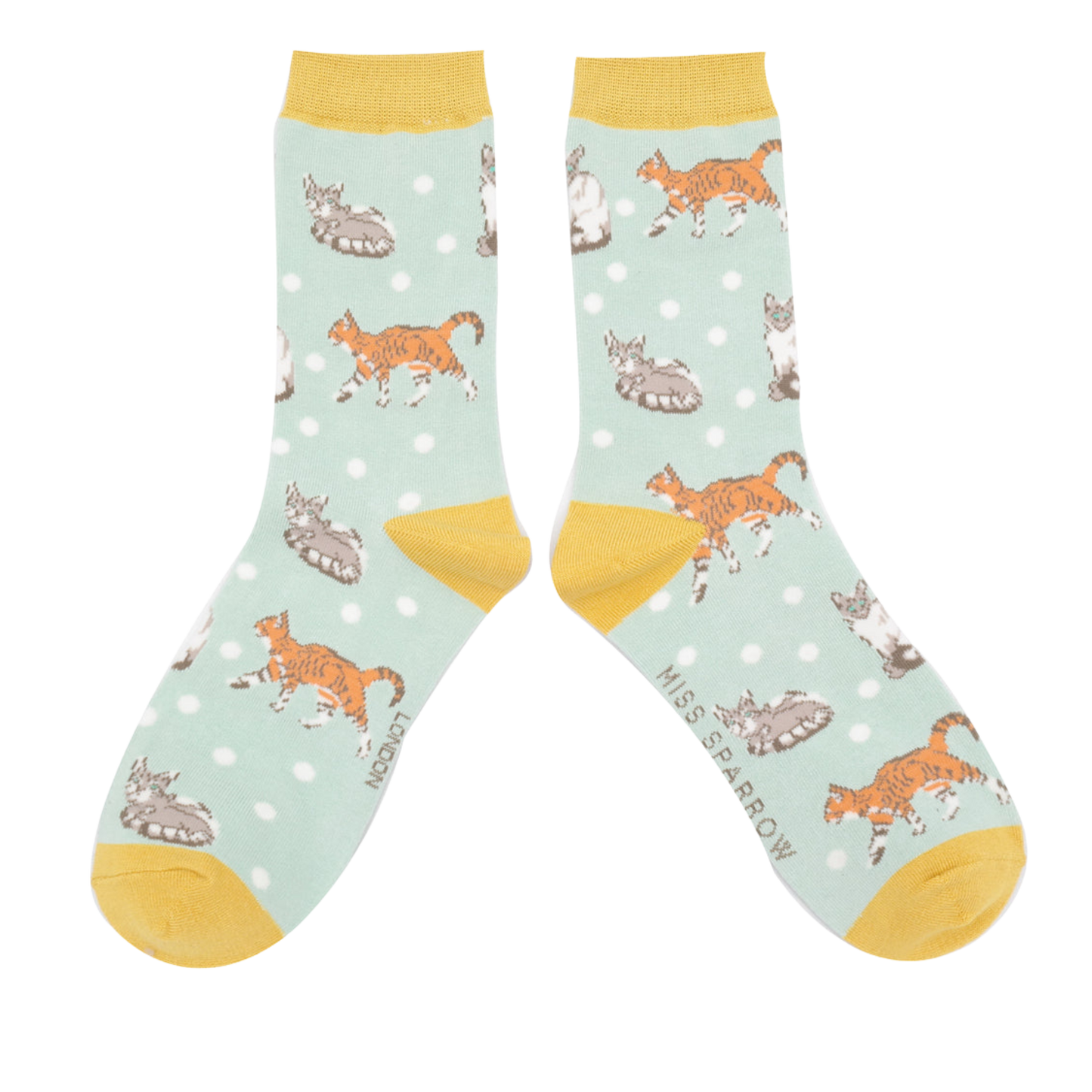 A pair of socks with a cat motif and spots pattern. Light blue legs, yellow heel, toe and cuff.