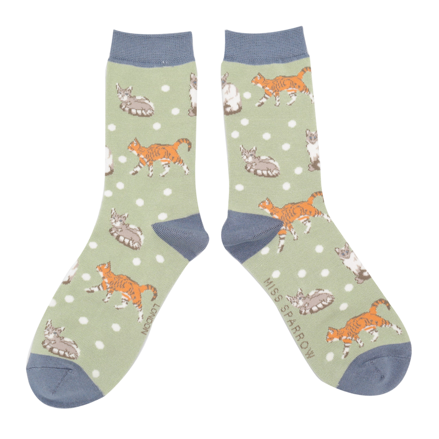 A pair of socks with a cat motif and spots pattern. Light green legs, blue heel, toe and cuff.