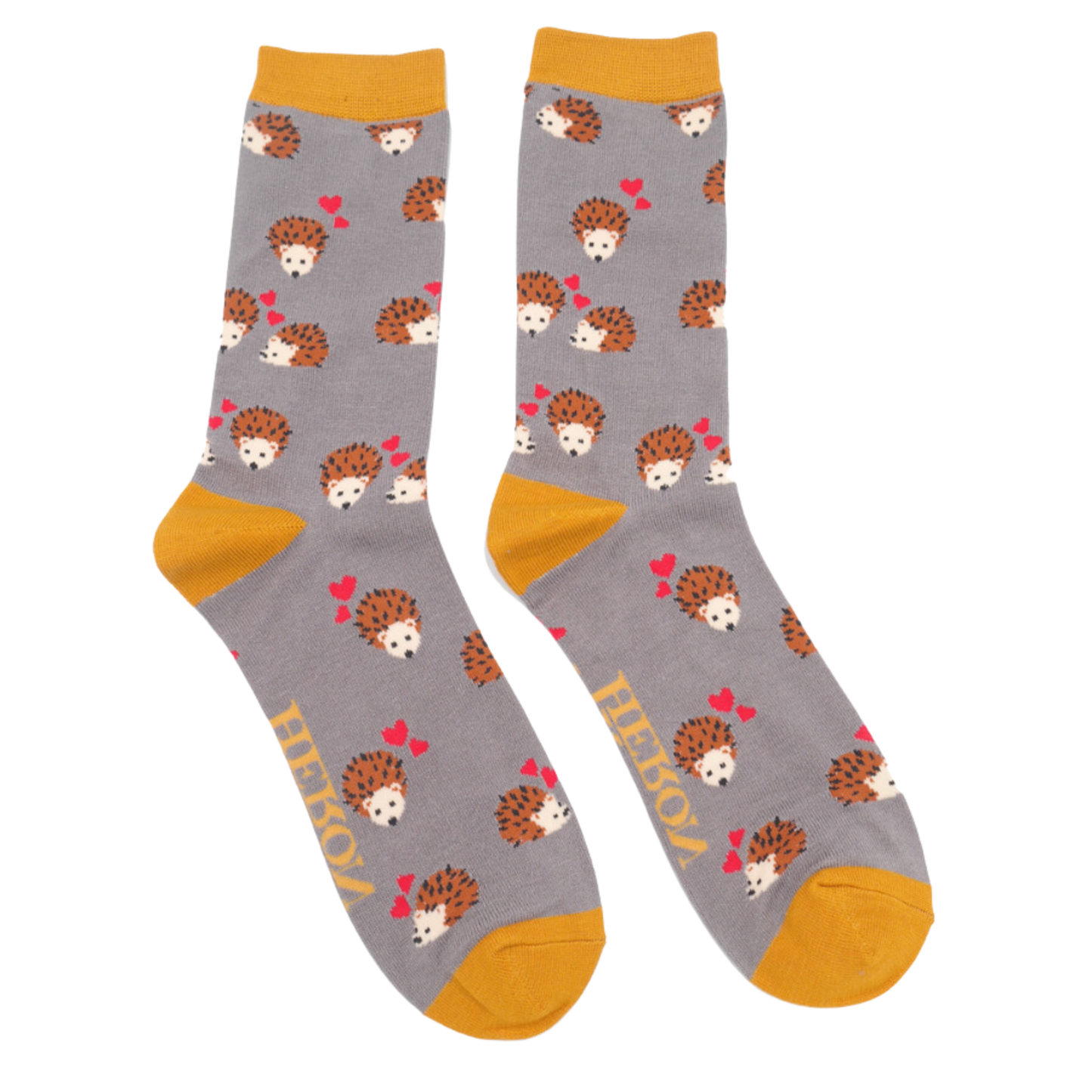 A pair of socks with a hedgehog and hearts motif. Grey legs, yellow heel, toe and cuff.