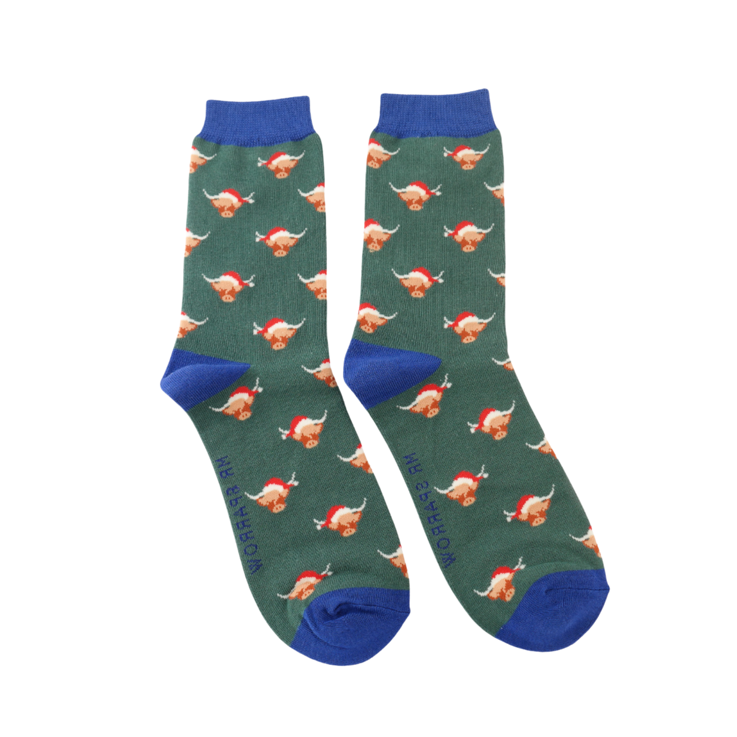 A pair of socks with a festive highland cow pattern. Dark green legs, blue heel, toe and cuff.