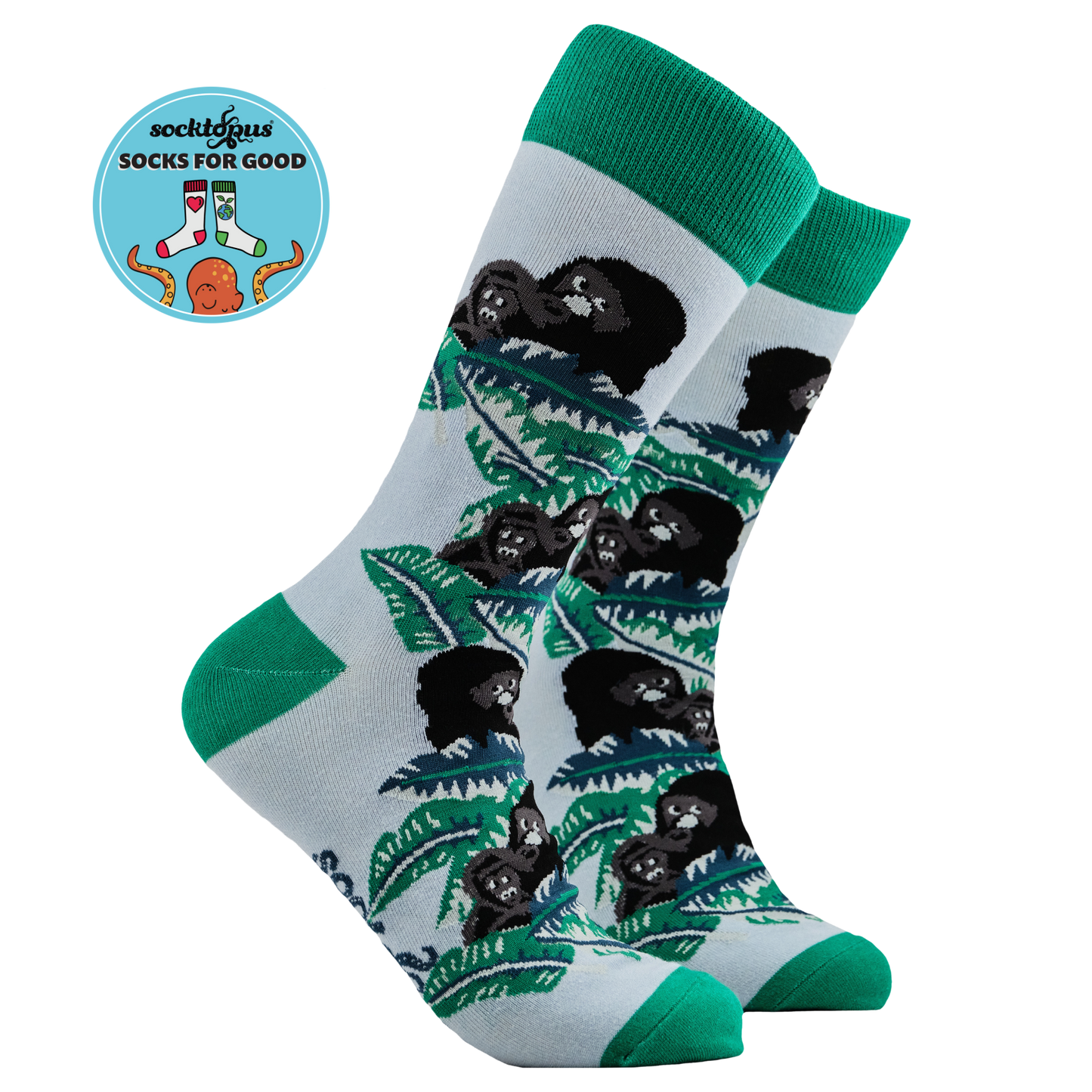 A pair of socks depicting gorillas in the forest. Green legs, green cuff, heel and toe.