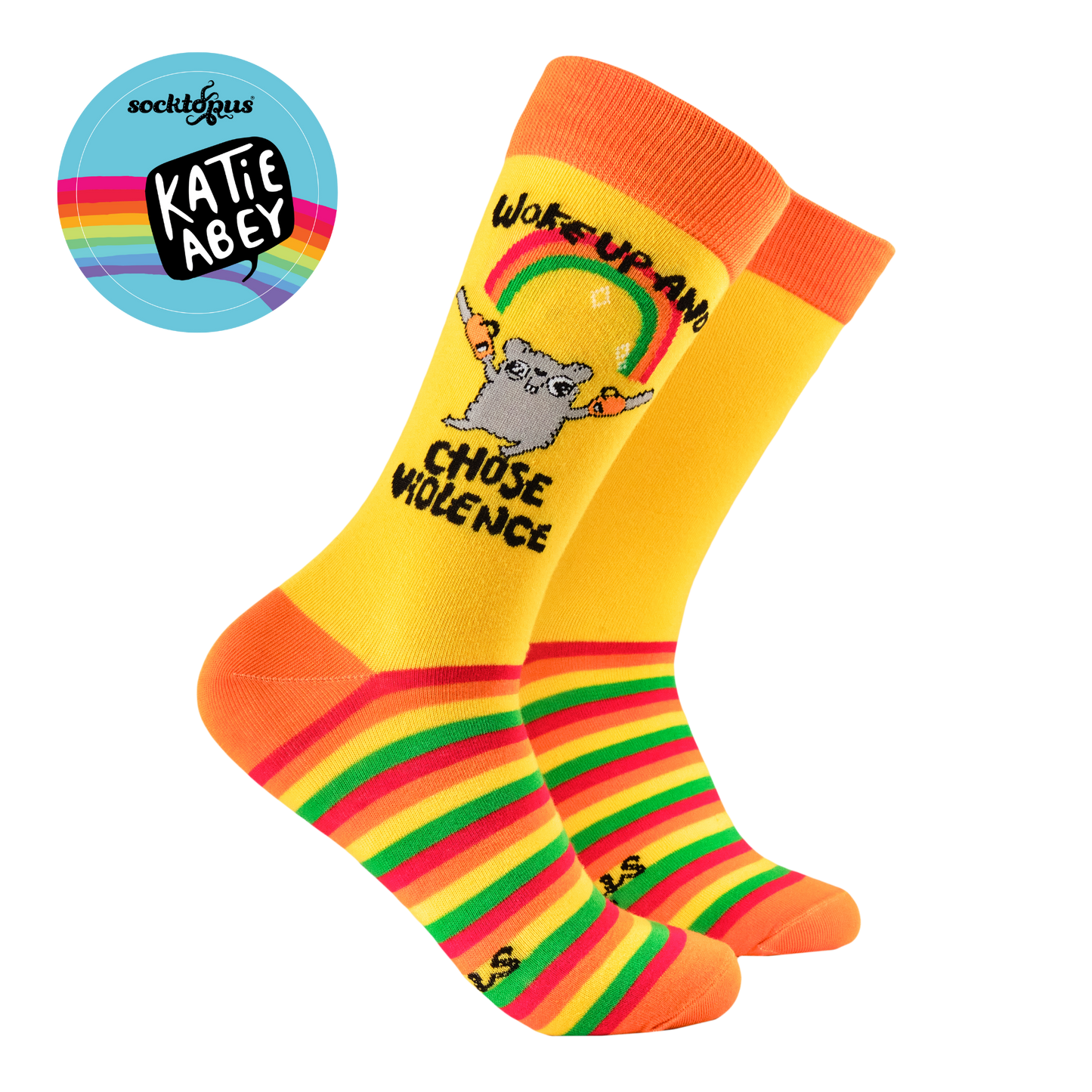 Chose Violence Socks - Soctopus X Katie Abey. A pair of socks depicting a mouse holding chainsaws with the slogan 'woke up and chose violence'. Yellow striped legs, orange toe cuff and heel.