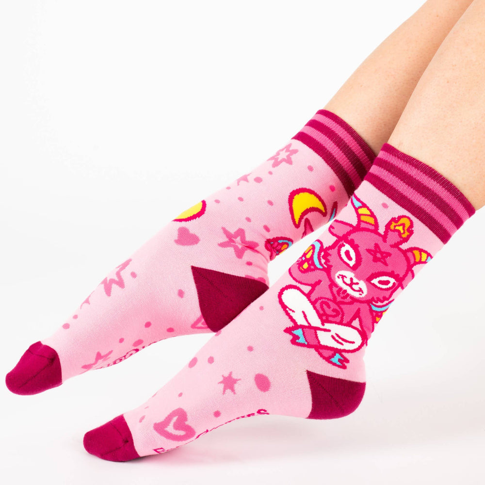 
                      
                        A pair of socks featuring a cute little devil. Pink legs, bright pink heel, toe and cuff. 
                      
                    