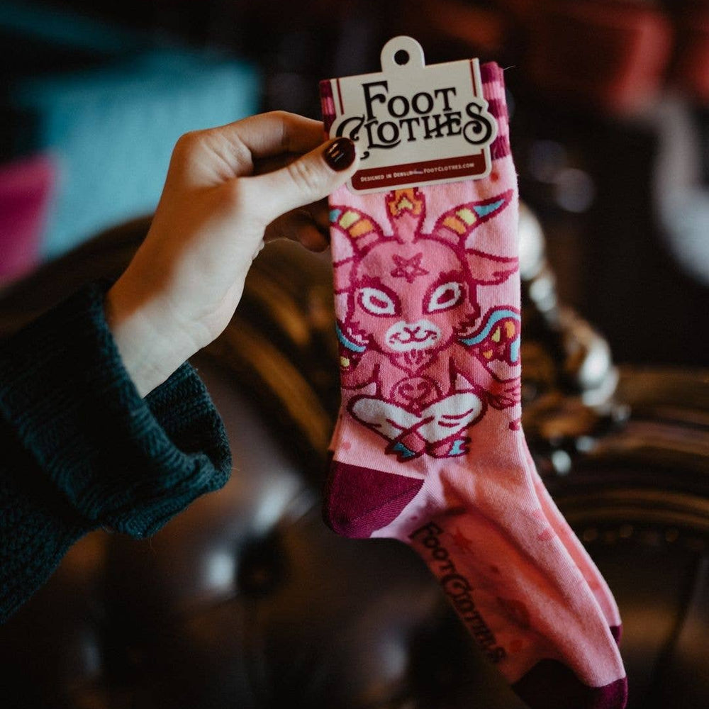 
                      
                        A pair of socks featuring a cute little devil. Pink legs, bright pink heel, toe and cuff. 
                      
                    