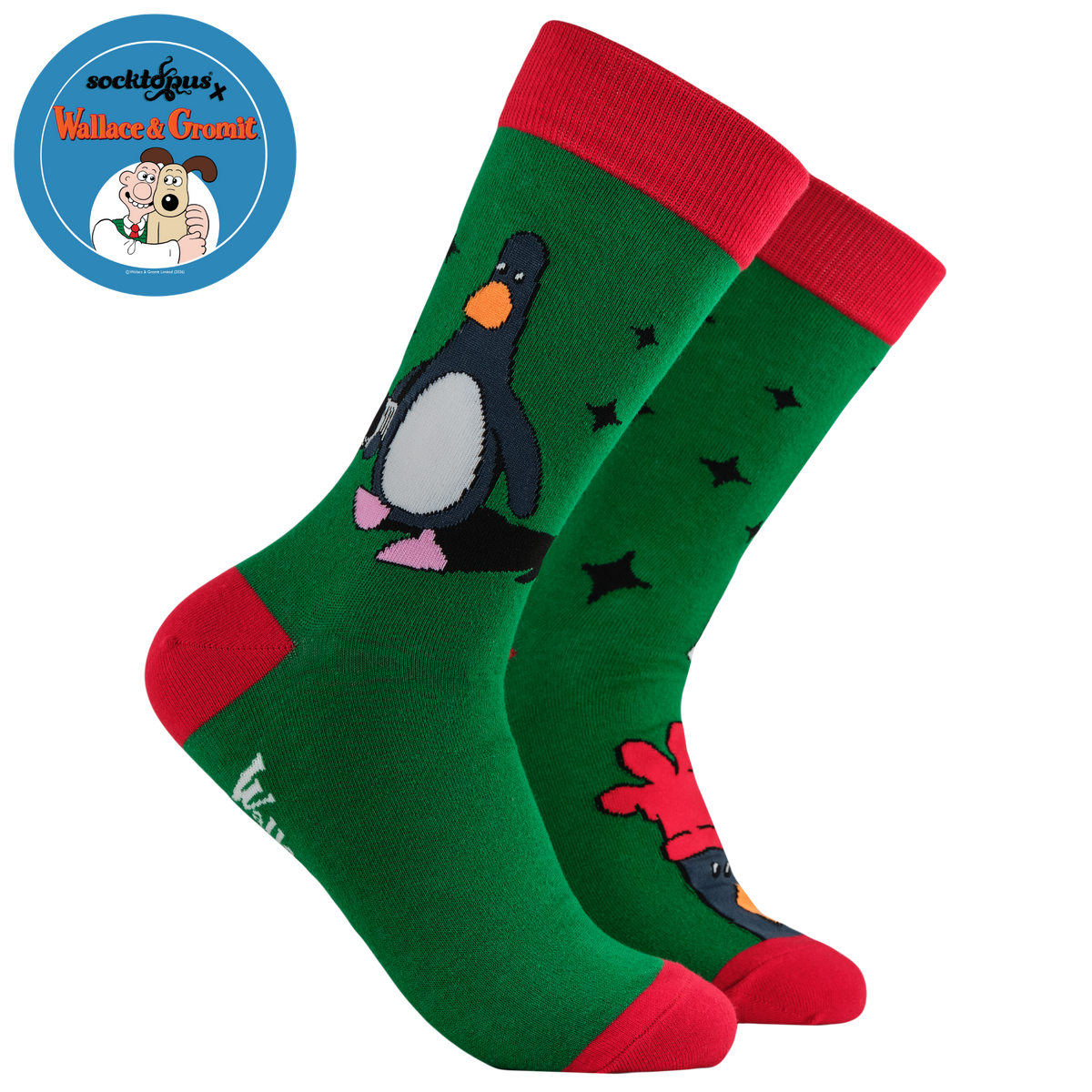 Green socks with red accents and penguin design on a white background

