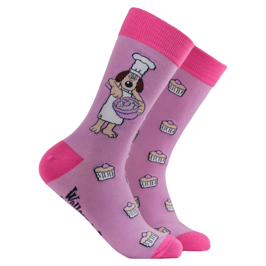 Baking Gromit Socks - Socktopus X Wallace & Gromit. A pair of pink socks featuring Gromit baking.