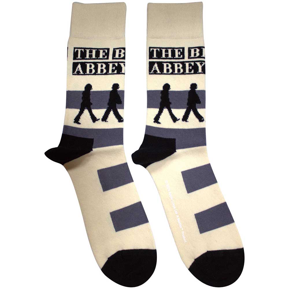 The Beatles Abbey Road Crossing Socks. A pair of socks featuring the iconic image from the cover of Abbey Road. Cream legs, black toe and heel. 