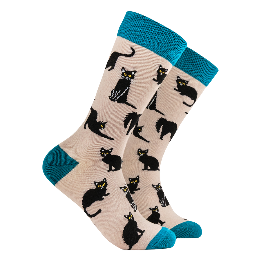 Black Cats Bamboo Socks. A pair of socks featuring lucky black cats. Beige legs, teal heel toe and cuff. 
