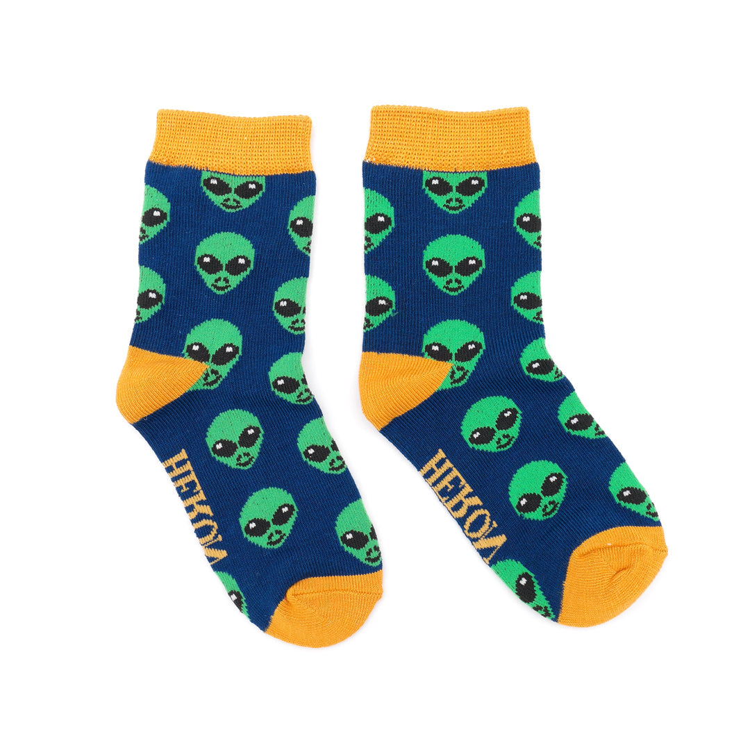 Blue socks with green alien pattern and yellow accents on a white background