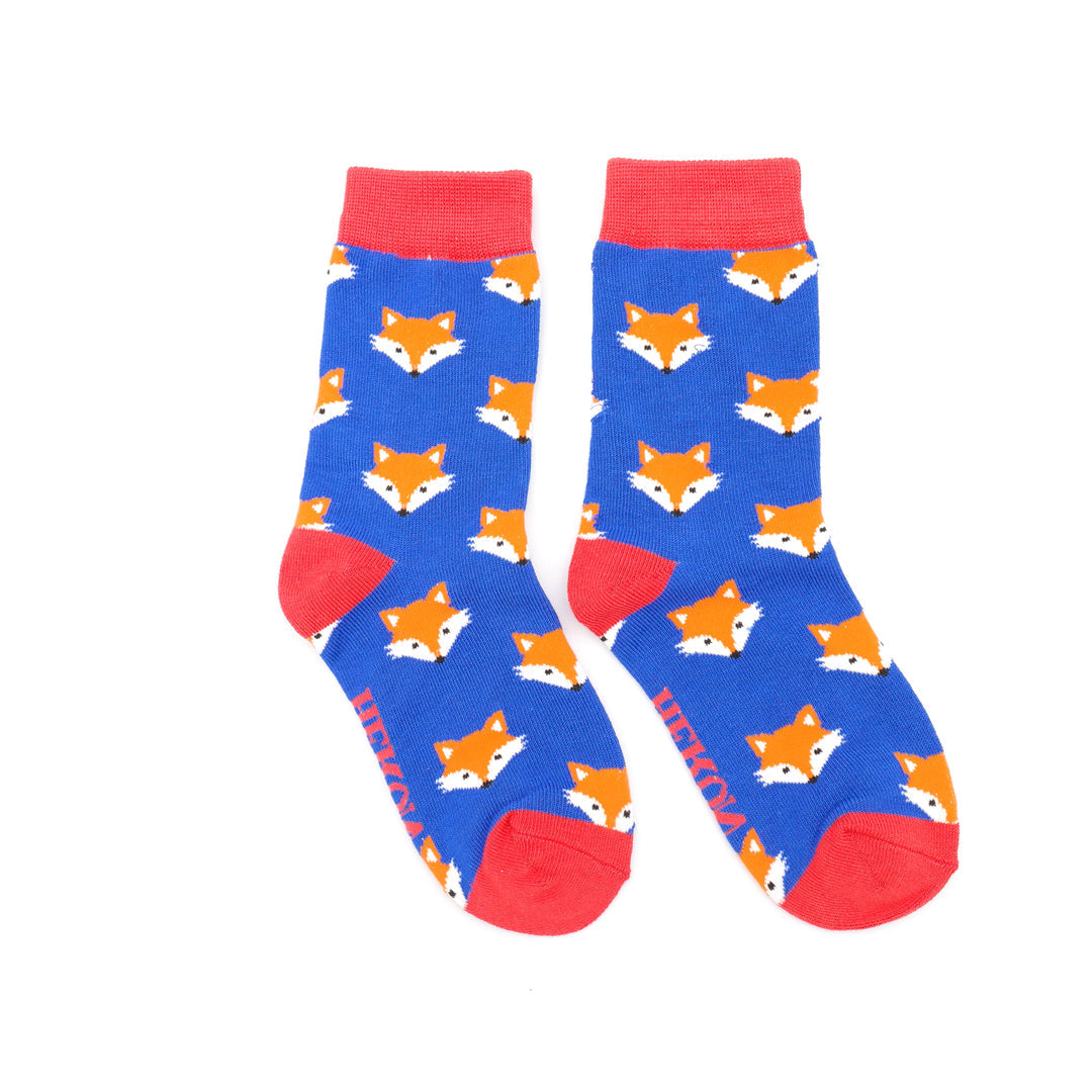 Pair of socks with fox pattern on a blue background