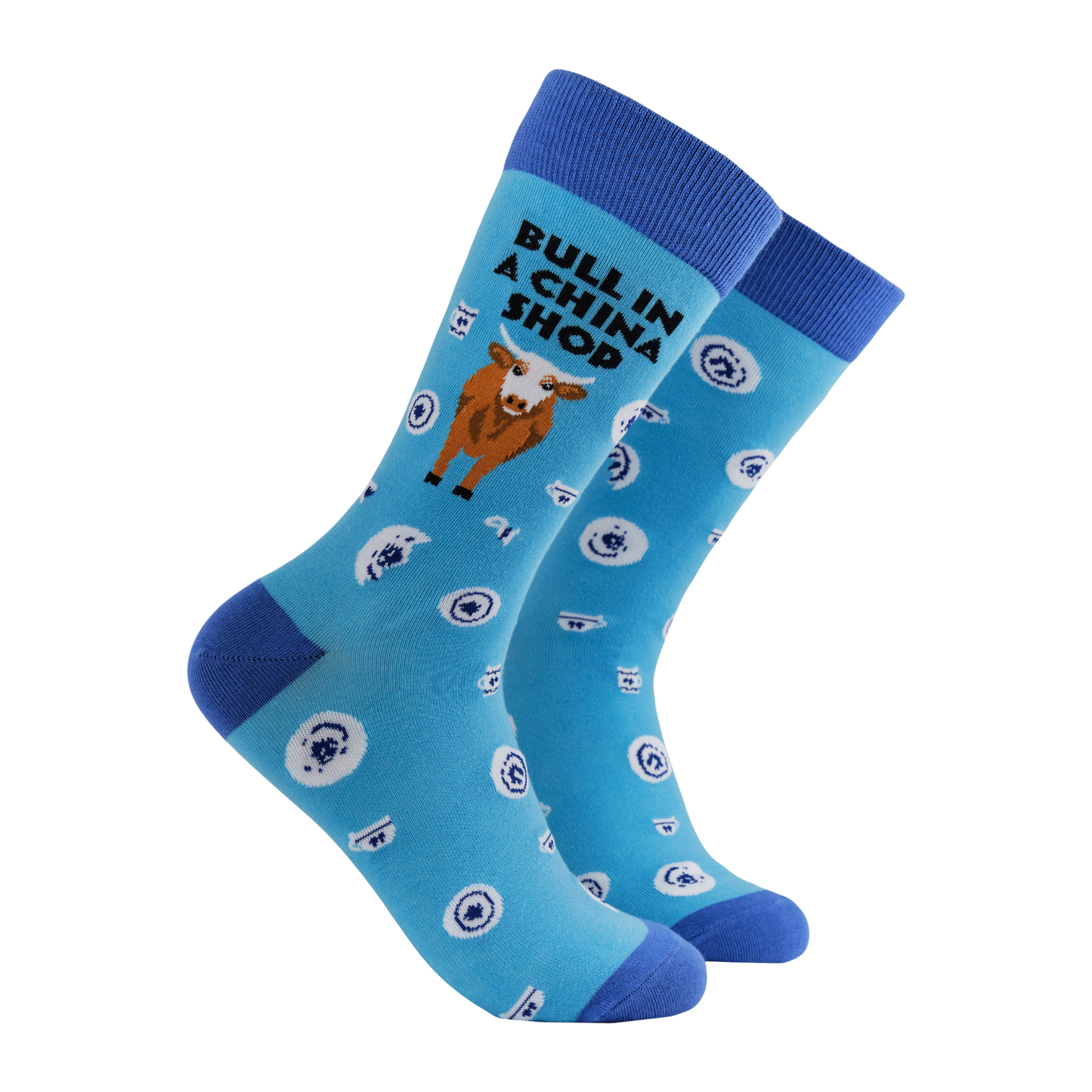Bull in a China Shop Socks - Bull-Dozing. A pair of socks featuring a bull in a china shop. Light blue legs, dark blue heel, toe and cuff. 