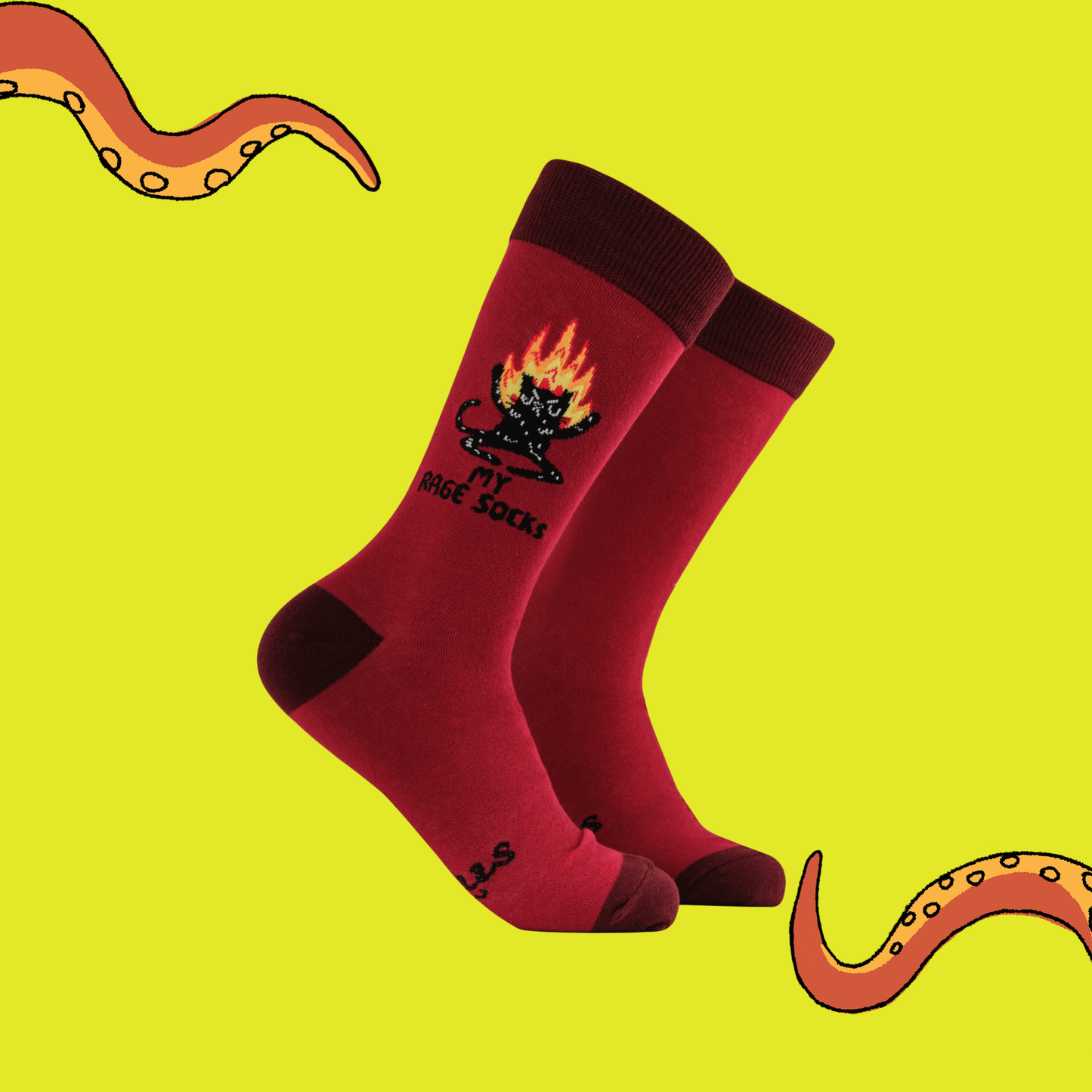 Red socks with a black design on a yellow background