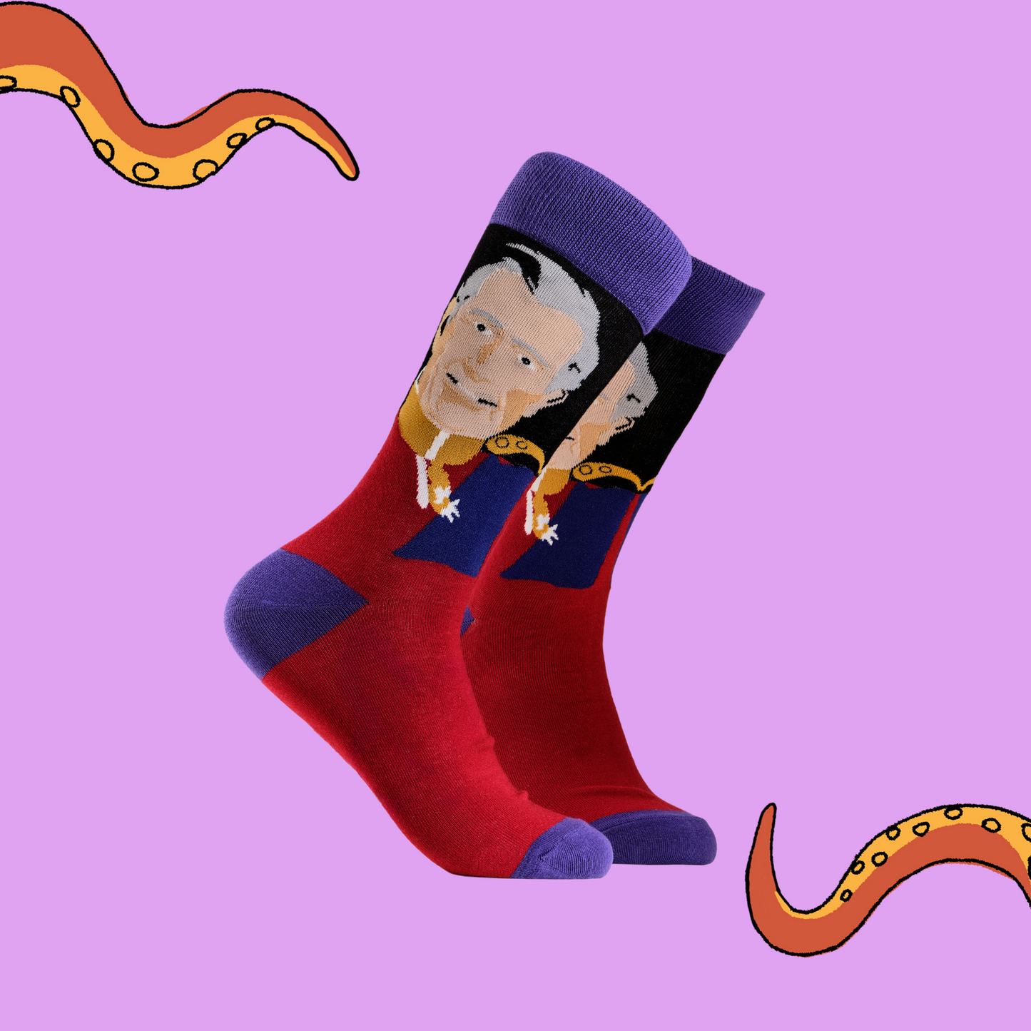 A pair of socks depicting King Charles III. Red legs, blue cuff, heel and toe.