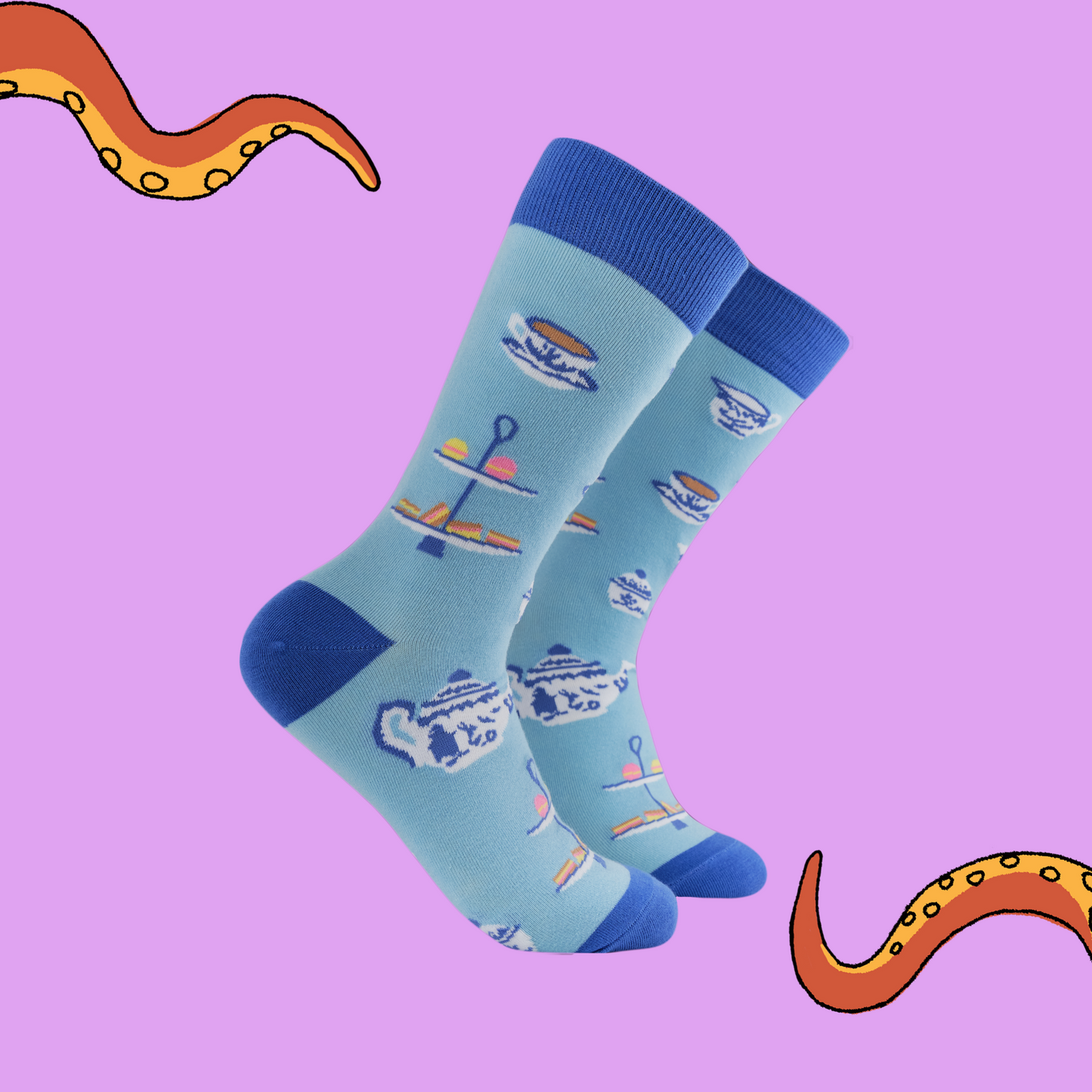 A pair of socks with a cream tea motif. Blue legs, dark blue heel, toe and cuff. 
